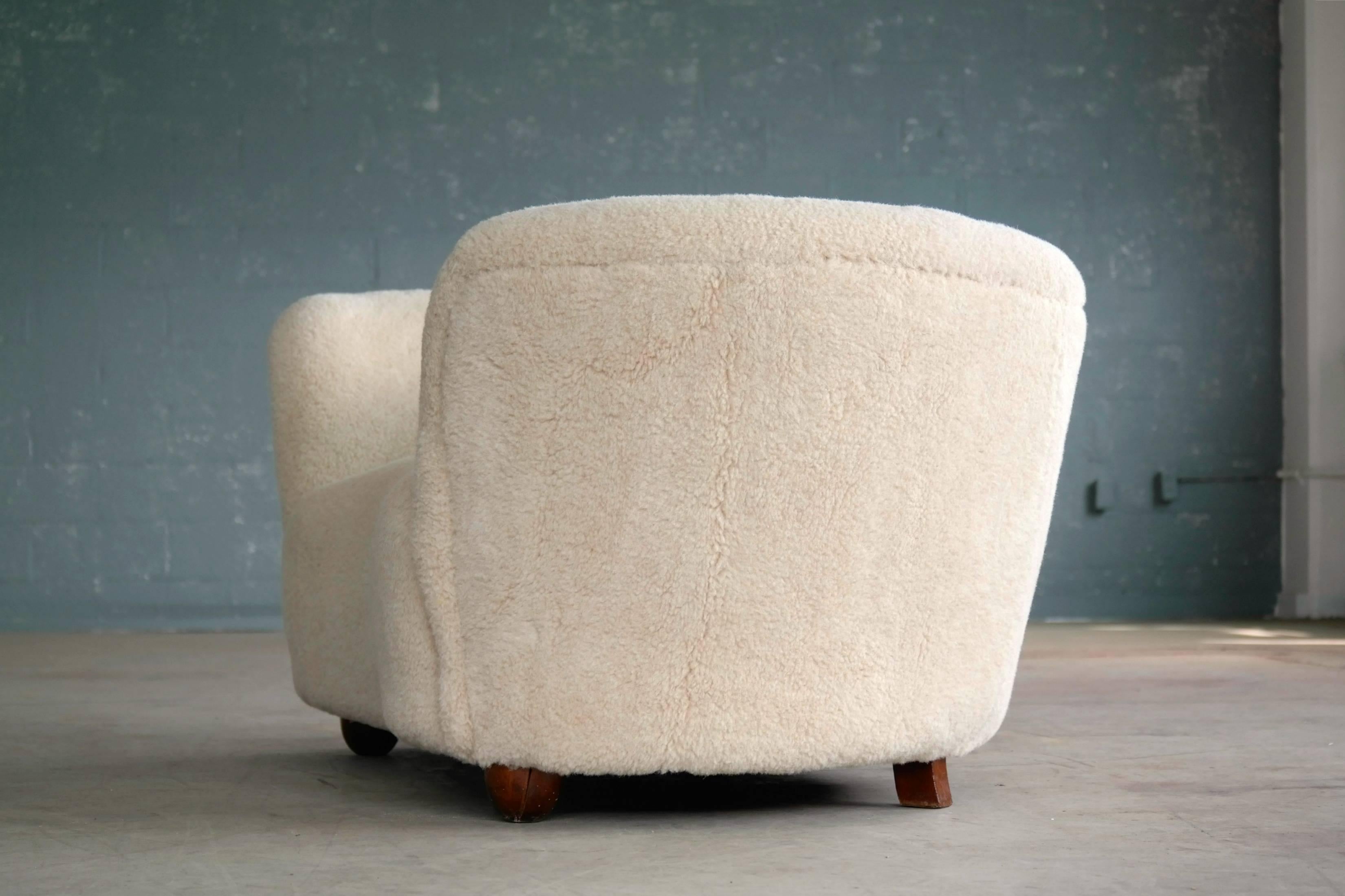 Wool Viggo Boesen Style Banana Shaped Curved Loveseat or Sofa Covered in Lambs, 1940s
