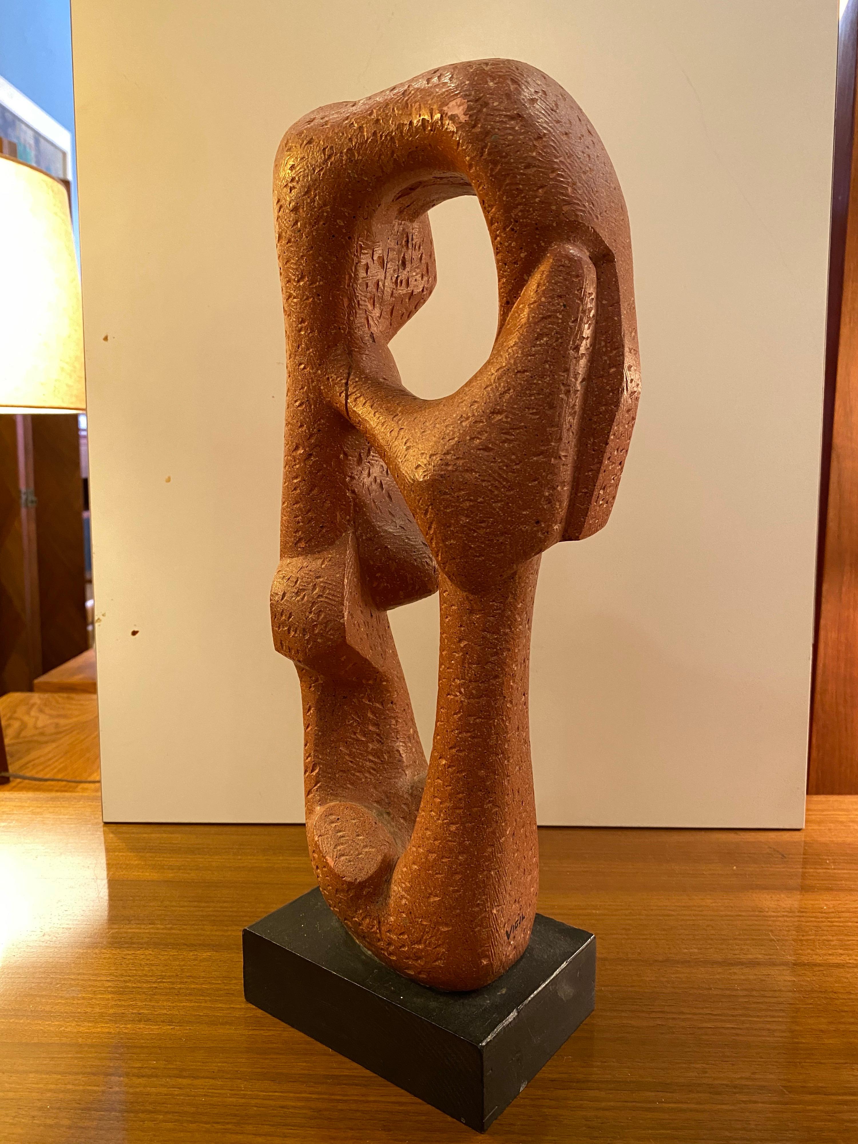 Abstract sculpture marked Vigil. Cast Hydrostone sculpture with a coral finish, mounted on a black wood base. From my research designed and produced in Texas in the 1950s.