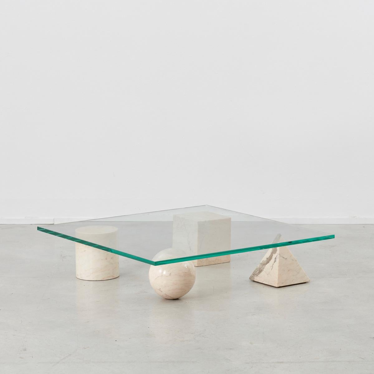 A stunning and sculptural Metafora coffee table designed by Lella and Massimo Vignelli. Inspired by the four forms of Euclidean geometry, the cube, the pyramid, the cylinder and the sphere, the four elements can be positioned freely for a unique