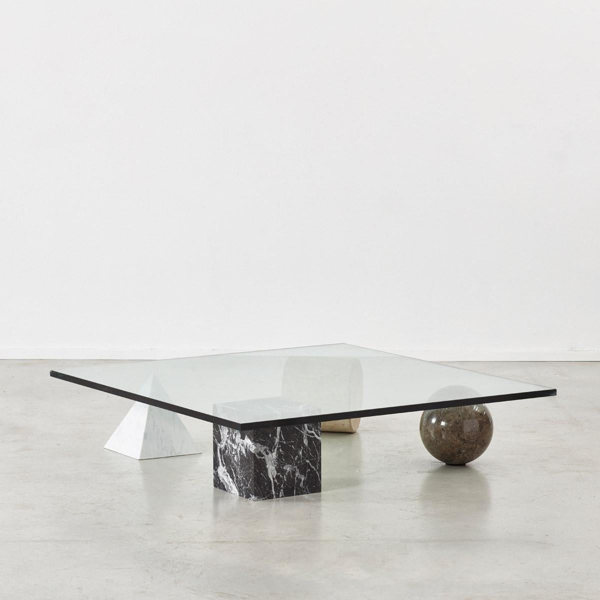 A stunning and sculptural Metafora coffee table designed by Lella and Massimo Vignelli. Inspired by the four forms of Euclidean geometry, the cube, the pyramid, the cylinder and the sphere, the four elements can be positioned freely for a unique