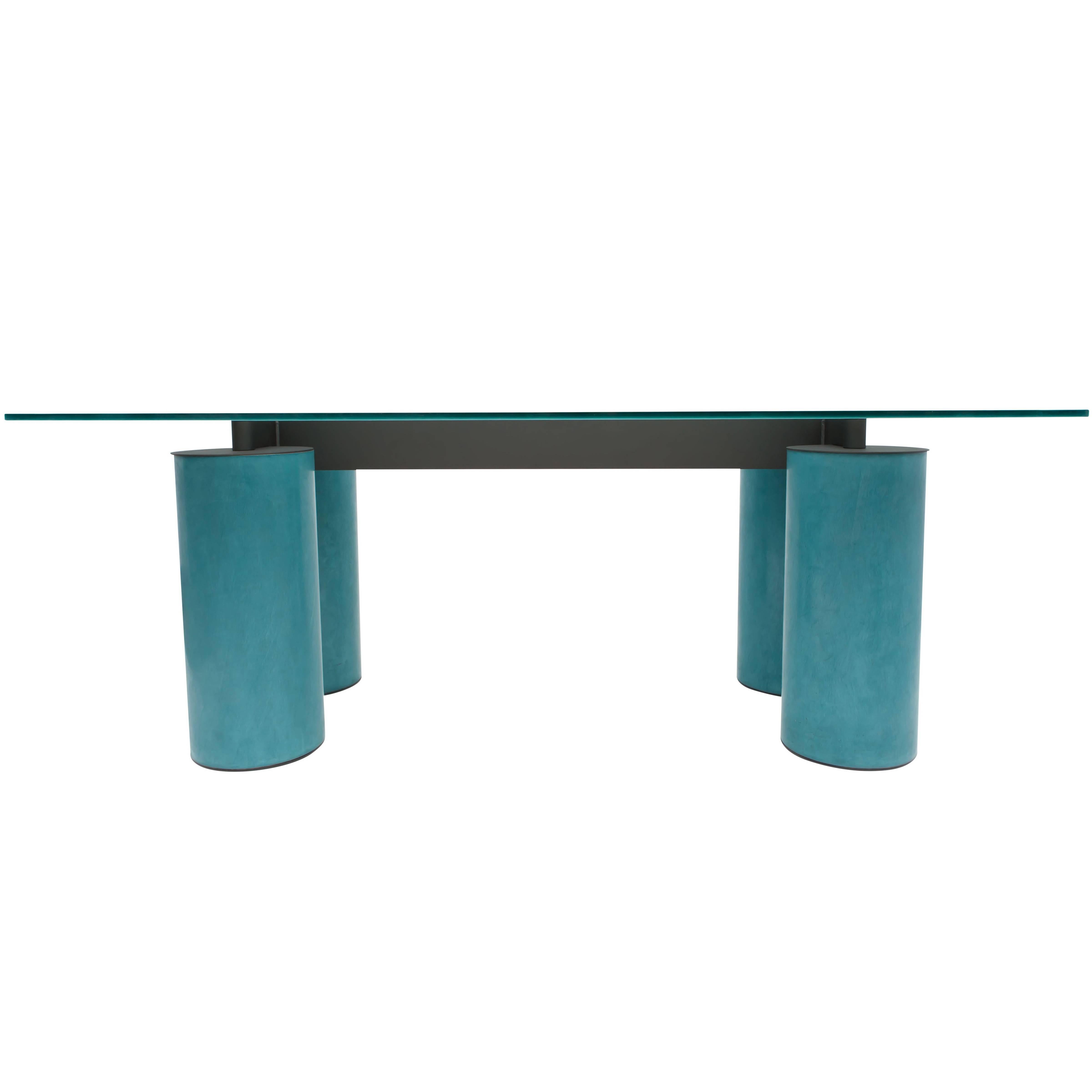 Turquoise desk or table manufactured by Acerbis and designed by David Law, Lella and Massimo Vignelli.
An opalescent crystal top on a turquoise cylindrical base.
Measures: H 72 cm x D 100 cm x W 200 cm.