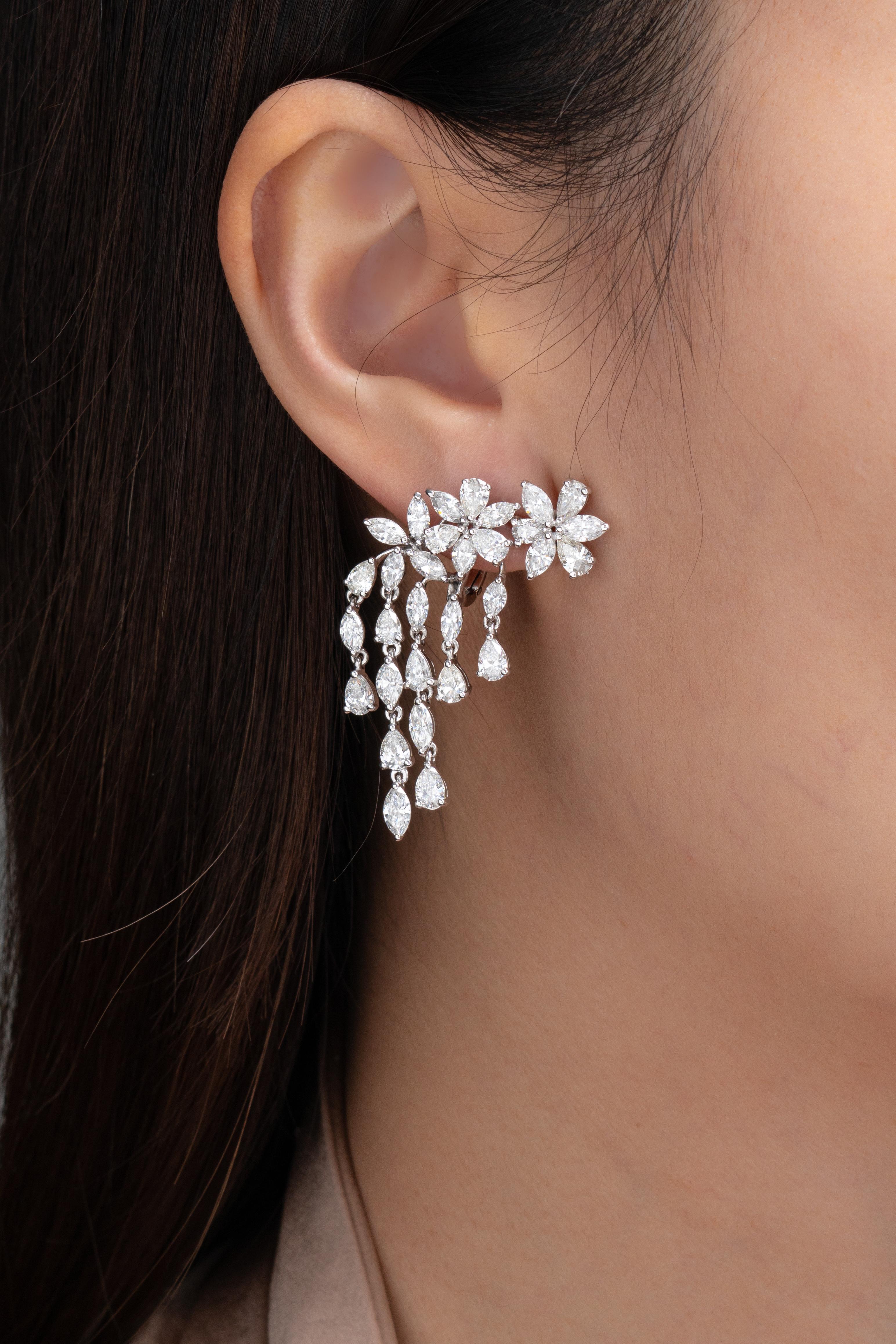 Cascade in diamonds while wearing these beautiful chandelier diamond earrings from Vihari Jewels. The earrings feature a floral motif with pear and marquise shaped diamonds with 5 cascading rows of diamonds delicately designed to hang in the