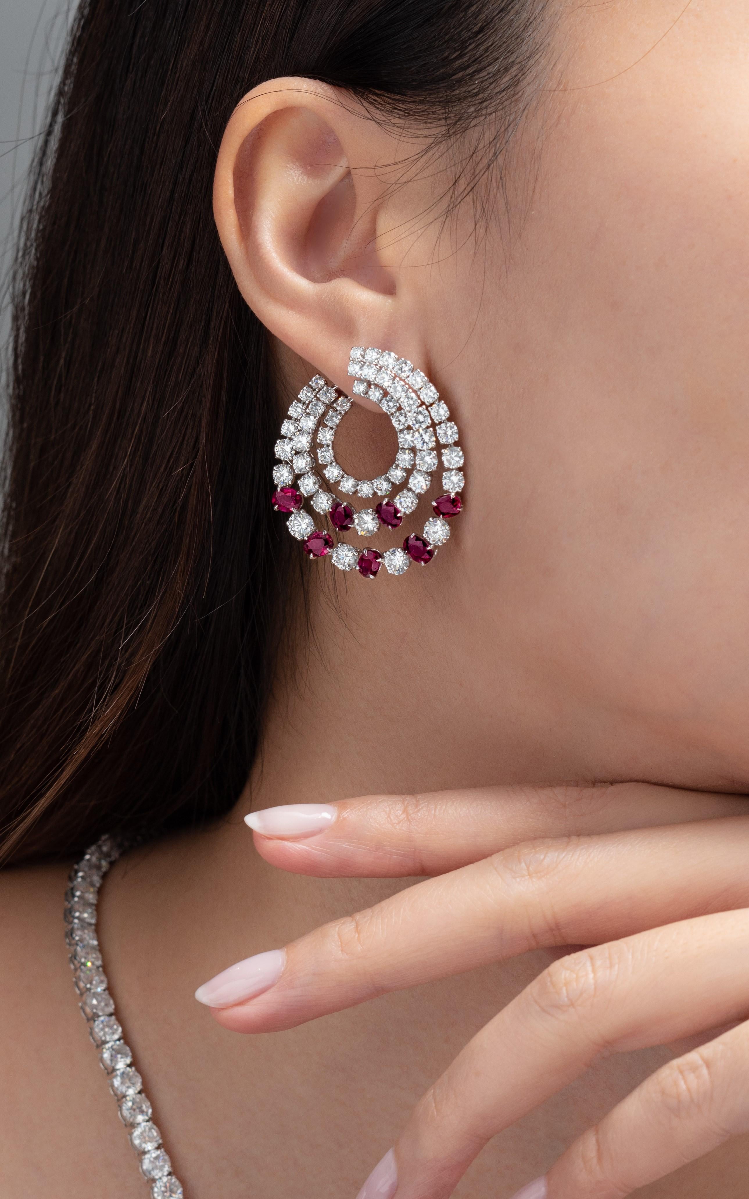If you're going for the wow factor, these earrings are just that. They illuminate with sparkle and fire. These Vihari Jewels hoop earrings features 3 rows of diamonds and rubies. There are a total of 106 round brilliant diamonds totaling 11.48