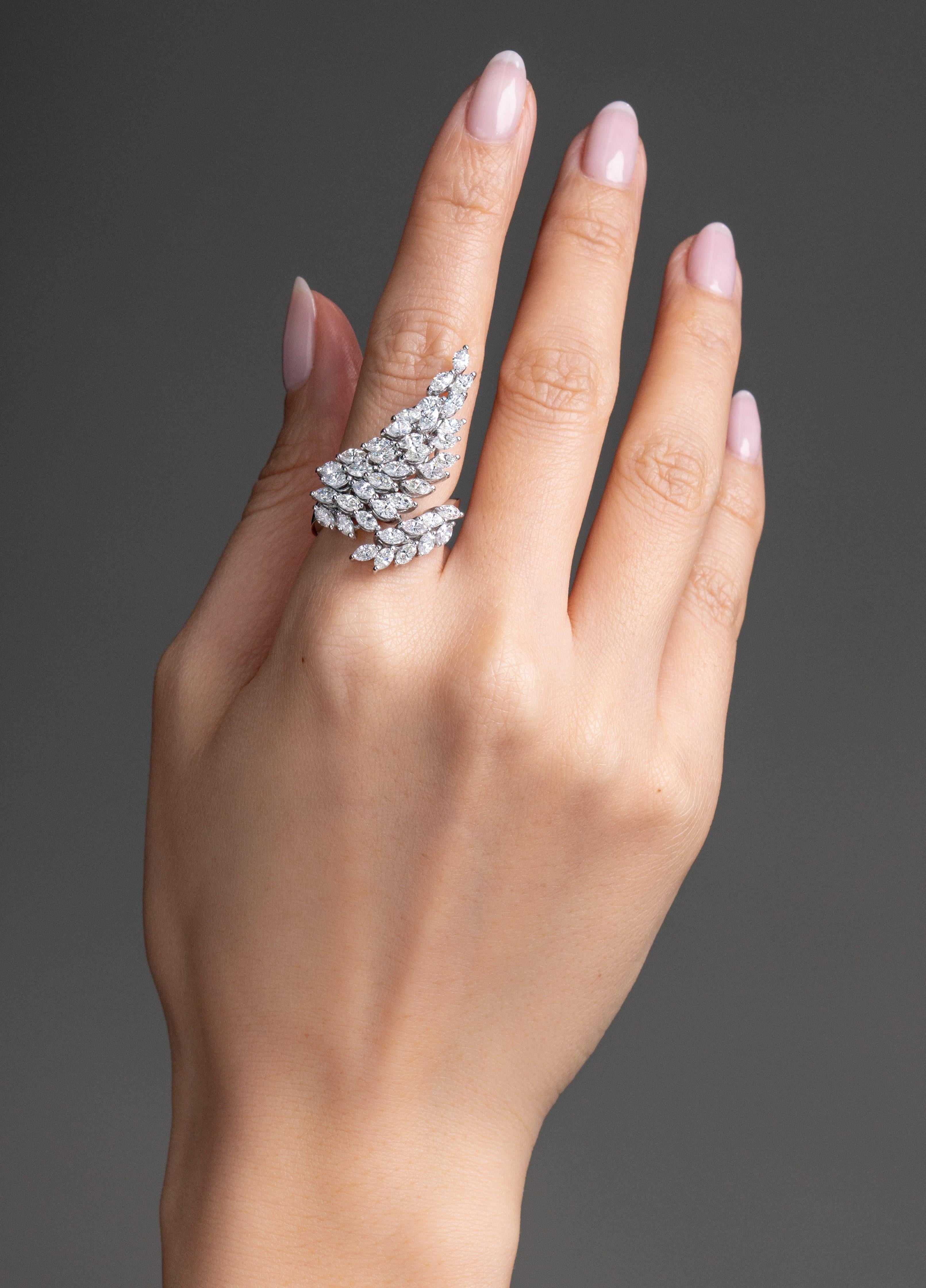 Inspired by angel wings, this Vihari Jewels marquise shaped diamond ring wraps the finger delicately and makes a fashionable statement! The diamond ring is set in 18K White Gold and features 3.68 carats of diamonds (all F color, VS+ clarity). The