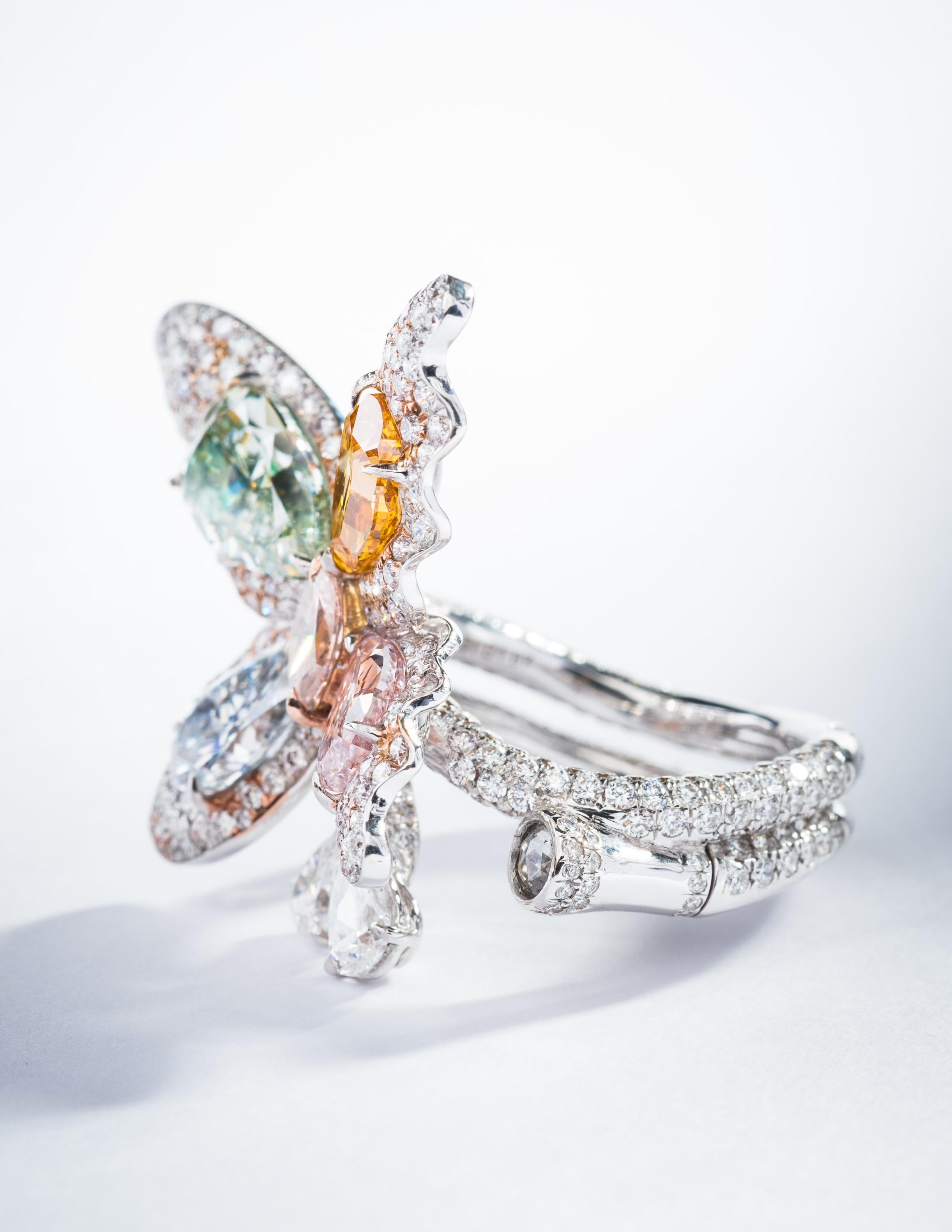 This piece is available for custom order only. 

A masterfully crafted, whimsical butterfly ring featuring fancy colored blue, green, pink and orange diamonds from Vihari Jewels. The ring is set with white diamonds in 18K White Gold and 18K Rose