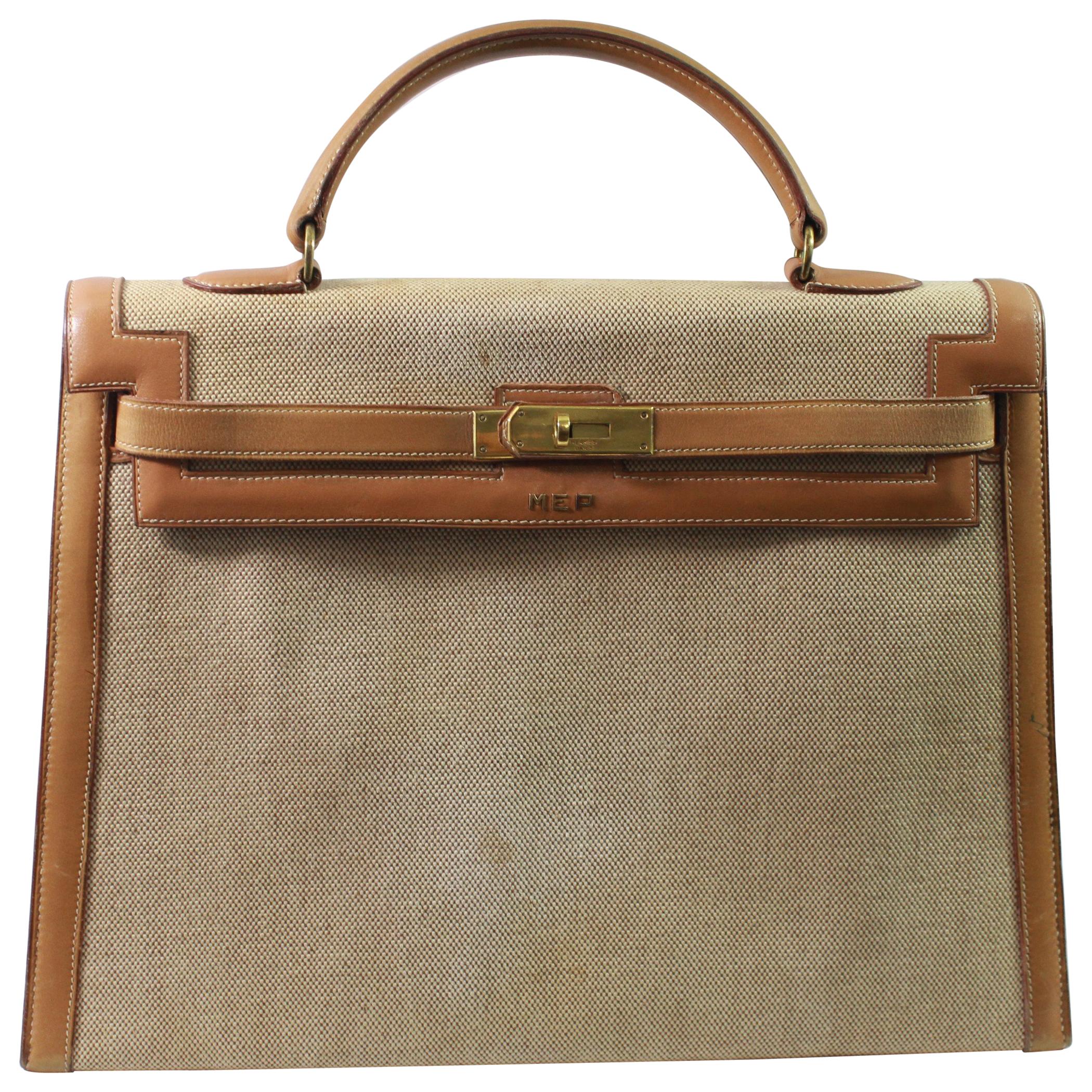Viintage Hermes Kelly 35 in Brown Leather and Canvas. Fair condition