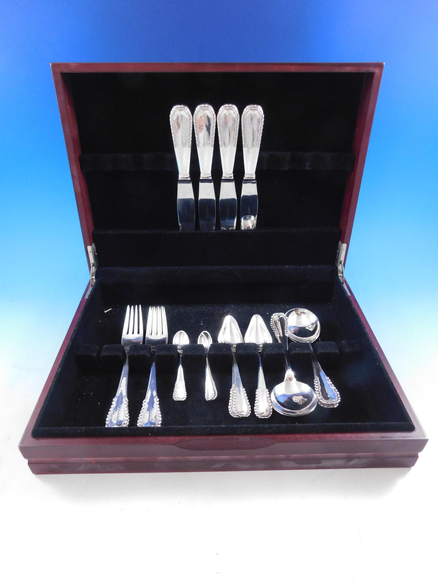 Rare Viking Aka Nordisk by Georg Jensen, circa 1927, sterling silver flatware set, 20 pieces. The pattern features a beaded design and beautiful subtle hand hammering. This set includes:

4 dinner size knives, 9