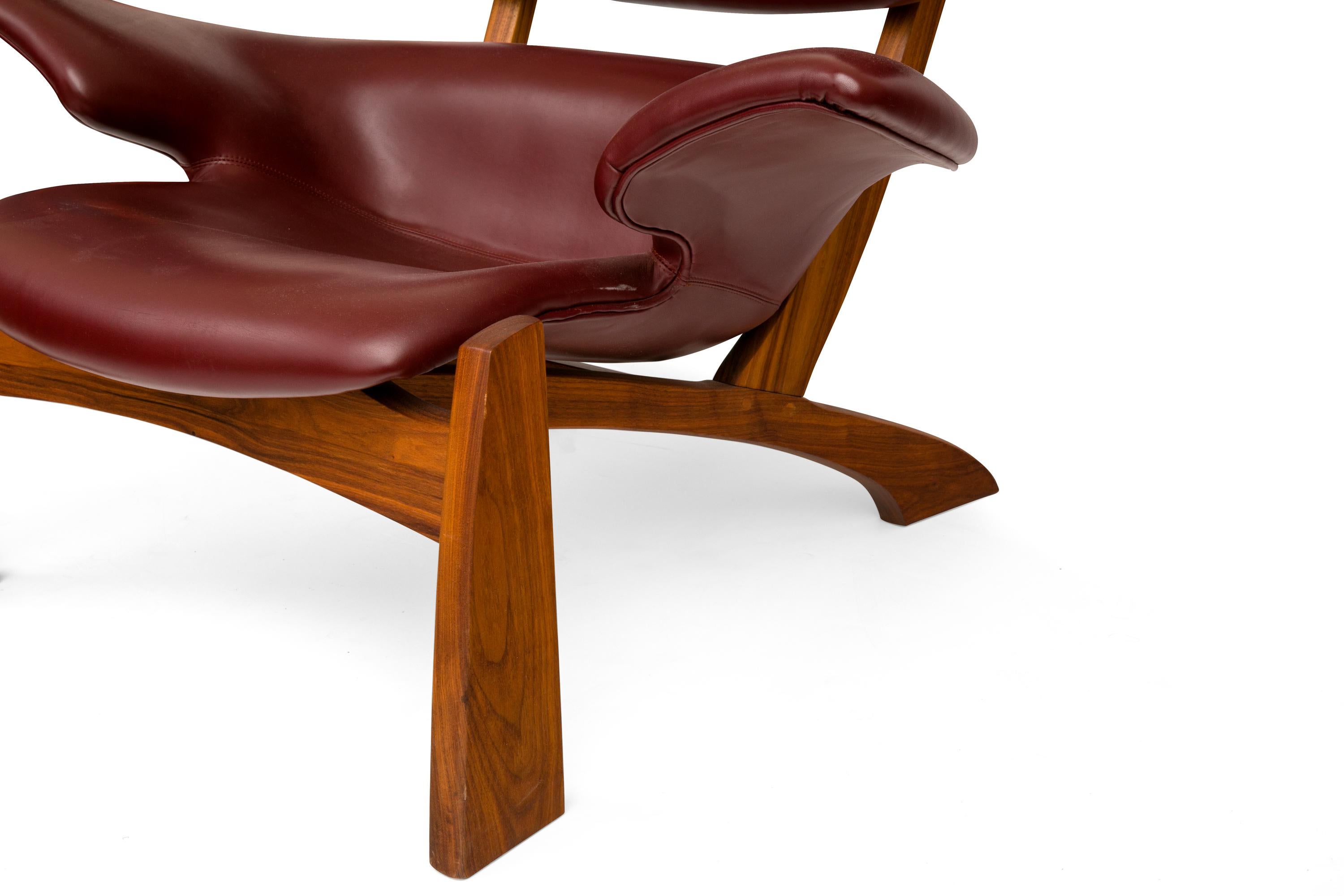 "Viking" Lounge Chair and Ottoman in Walnut and Bordeaux Aniline