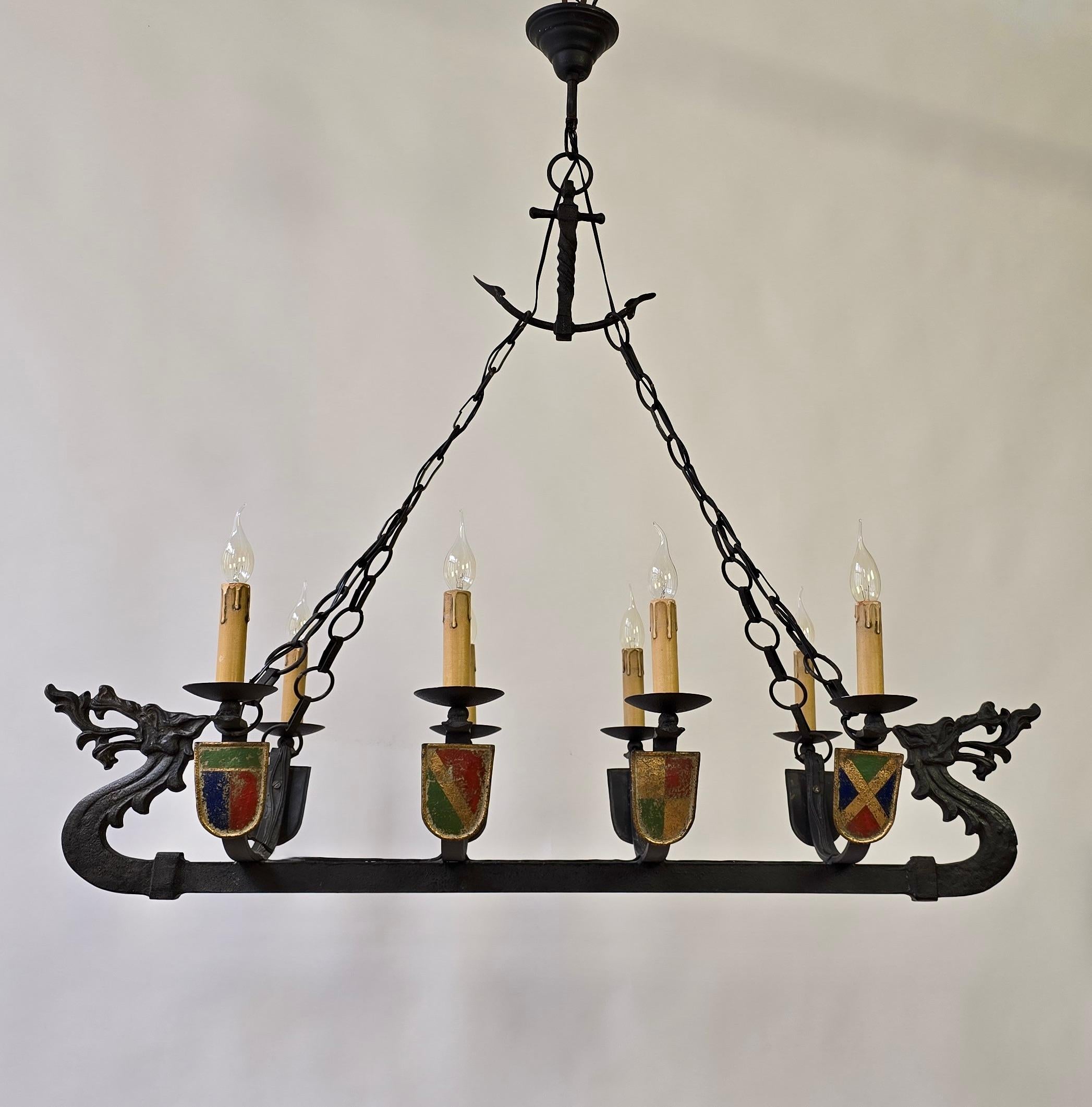Unique Viking Ship Dragon Boat Chandelier – Wrought Iron Medieval Style

Impressive medieval wrought iron Viking Ship Dragon Boat chandelier. This rare masterpiece is made entirely of solid wrought iron and detailed with hand-painted heraldic