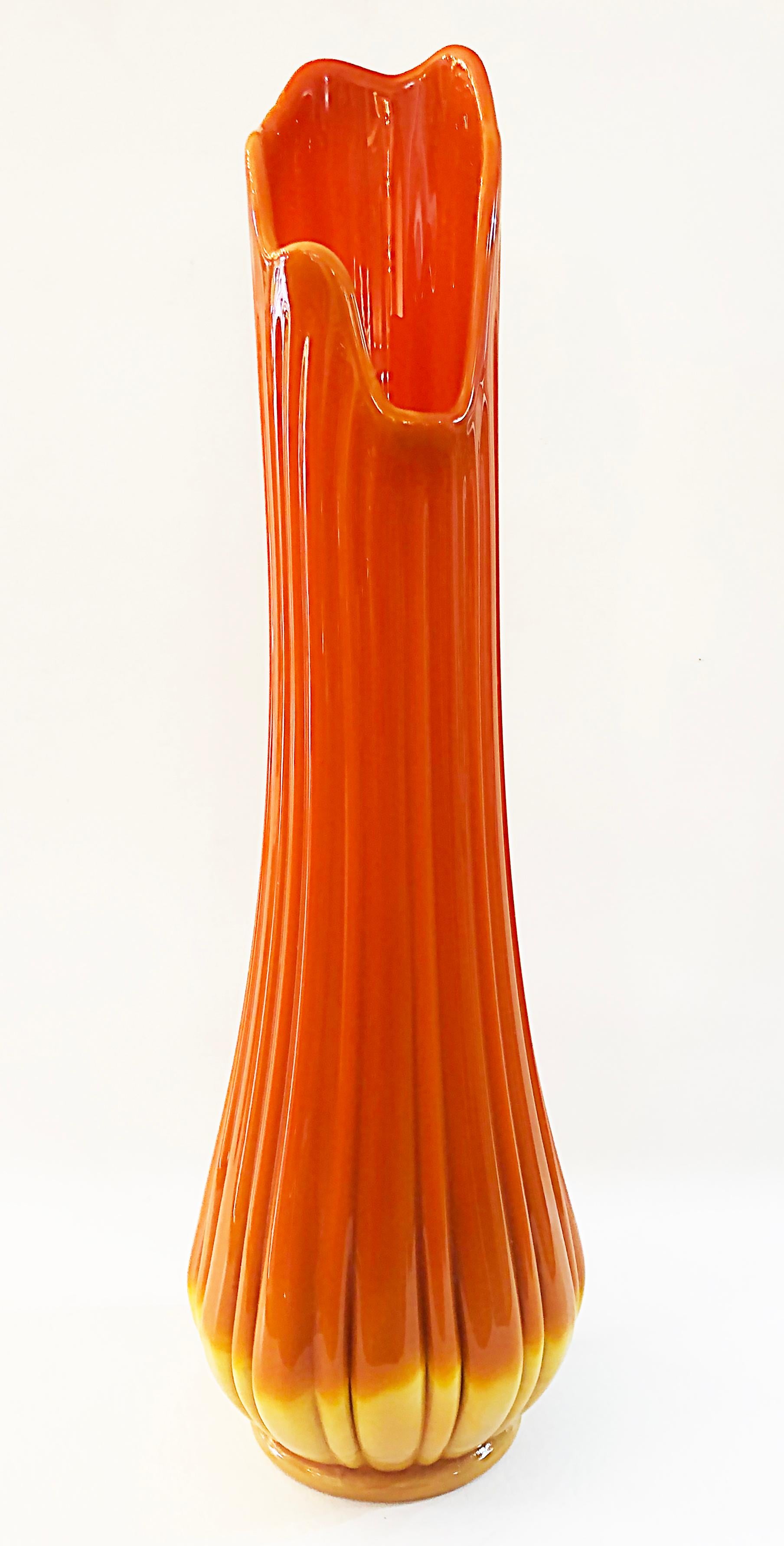 Viking swung orange glass vase attributed to L.E. Smith, 1960s.

Offered for sale is a Mid-Century Modern opaque orange swung glass vase attributed to L. E. Smith. This is an 1960s iconic custard glass vase in bold colors of the period.