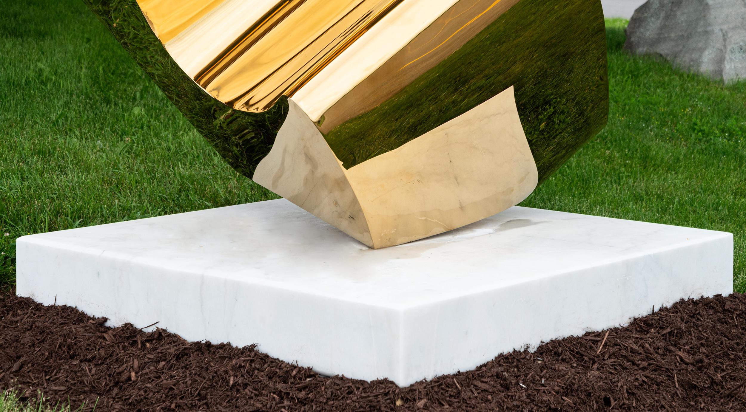 This large, abstract, 24kt gold-plated, white marble, outdoor sculpture was created by Viktor Mitic. 

The beautiful lyrical lines of Orion were crafted from 24 kt gold-plated stainless steel by Viktor Mitic. Its striking abstract form is named for