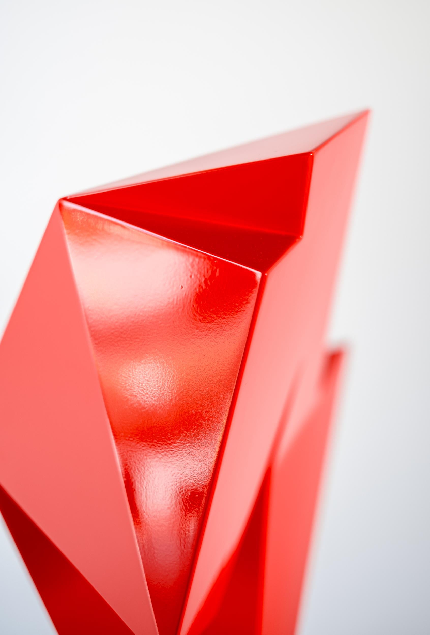 This abstract steel table-top sculpture by Viktor Mitic has a red geometric form.

Forged from stainless steel, this compelling sculpture by Viktor Mitic is painted a bright red, which accentuates its dynamic form. Angles meet fluid curves in this