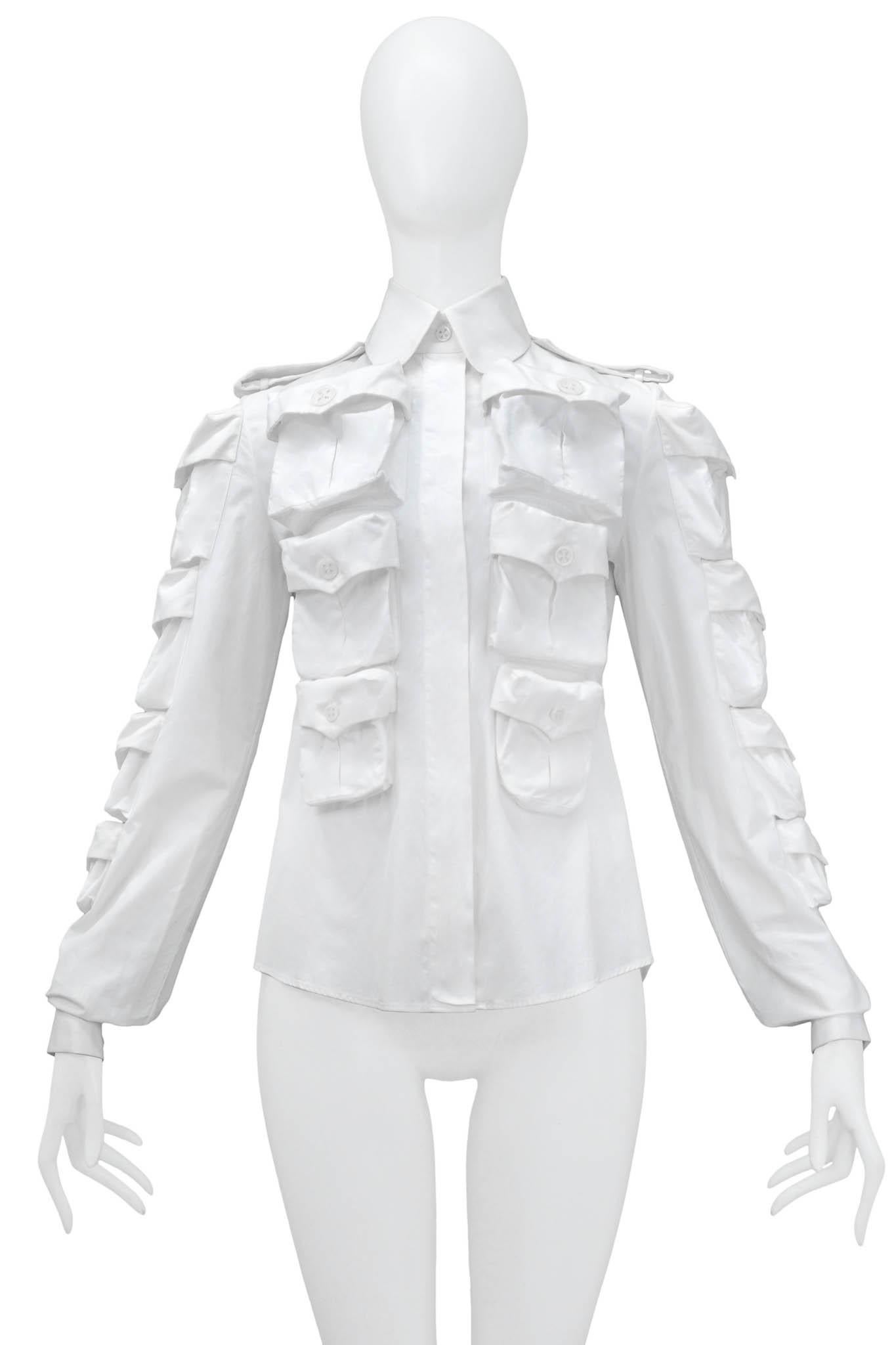 Resurrection Vintage is excited to present a vintage Viktor & Rolf white multi-pocket button-down featuring, pockets on the front, back, and sleeves, a pointed collar, and shirt epaulets.

Viktor & Rolf
Size: S
Cotton
Circa 2002
Excellent Vintage