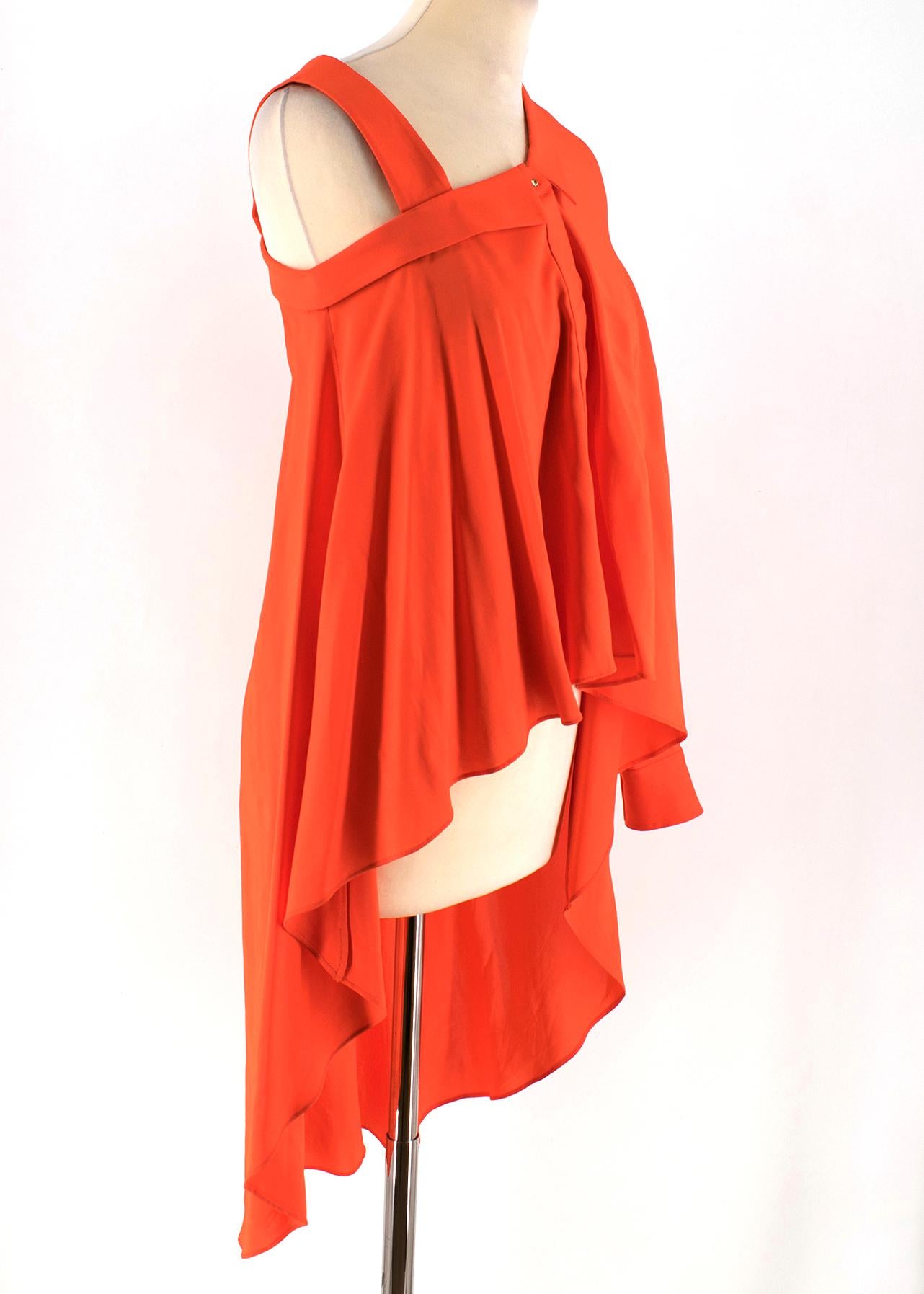 Viktor & Rolf Neon Orange Top

- Neon orange shirt
- Asymmetric neckline
- Left arm long sleeve with ruched cuff
- Right arm sleeveless with a shoulder strap
- Centre-front button fastening
- Asymmetric length, short-length front and long-length