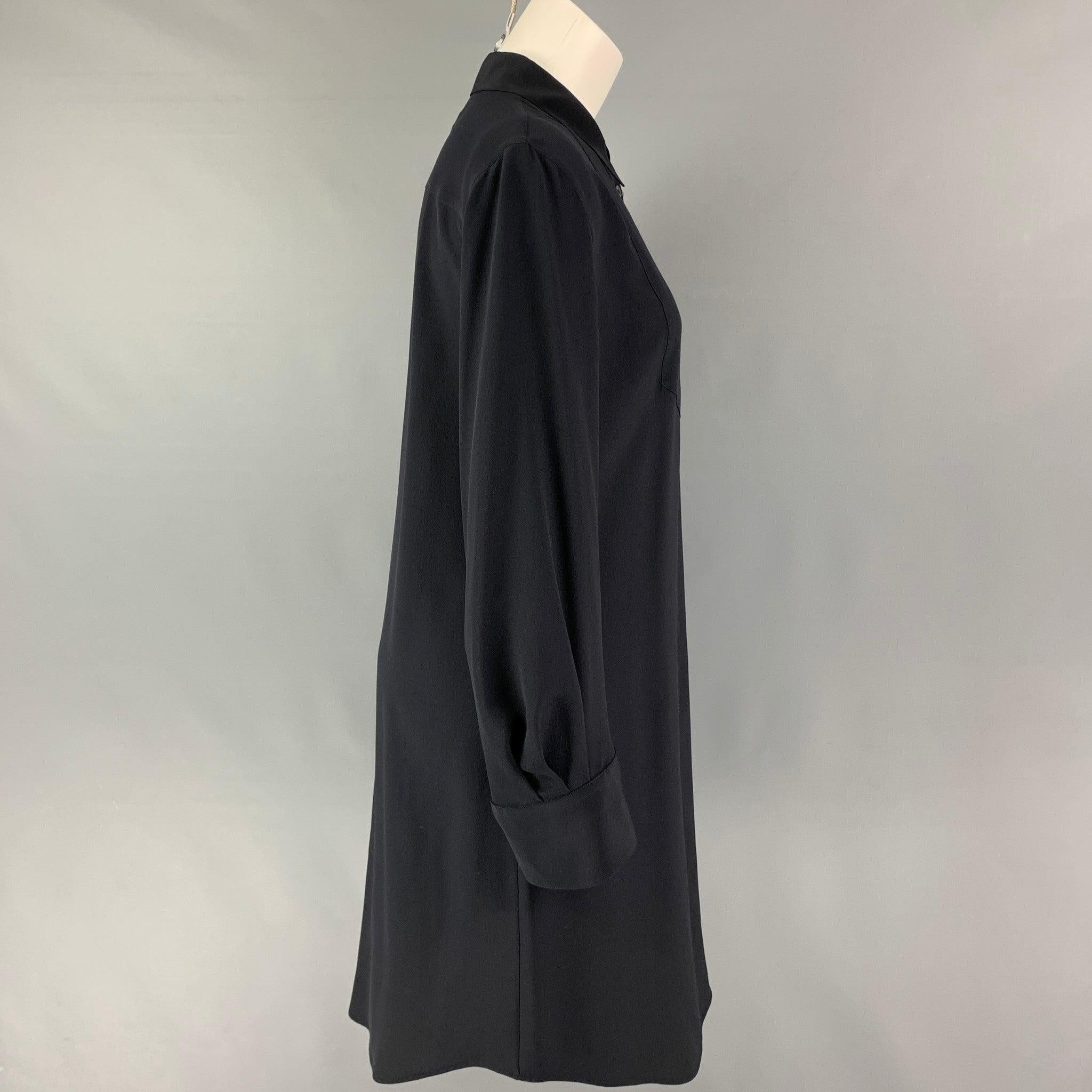VIKTOR & ROLF shirt dress comes in a black silk featuring a pointed collar and a buttoned closure.
Very Good
Pre-Owned Condition. 

Marked:   46 

Measurements: 
 
Shoulder: 17 inches  Bust: 39 inches  Hip: 38 inches  Sleeve: 24.5 inches  Length: