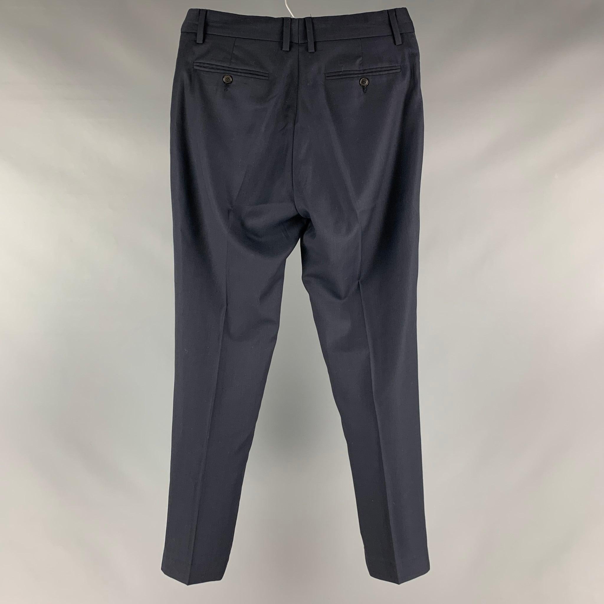 VIKTOR & ROLF dress pants comes in a navy wool woven material featuring a slit pockets, front tab, and a zip fly closure. Made in Italy.Excellent Pre-Owned Conditions. 

Marked:  48 

Measurements: 
 Waist: 30 inches Rise: 9 inches Inseam: 31 inches