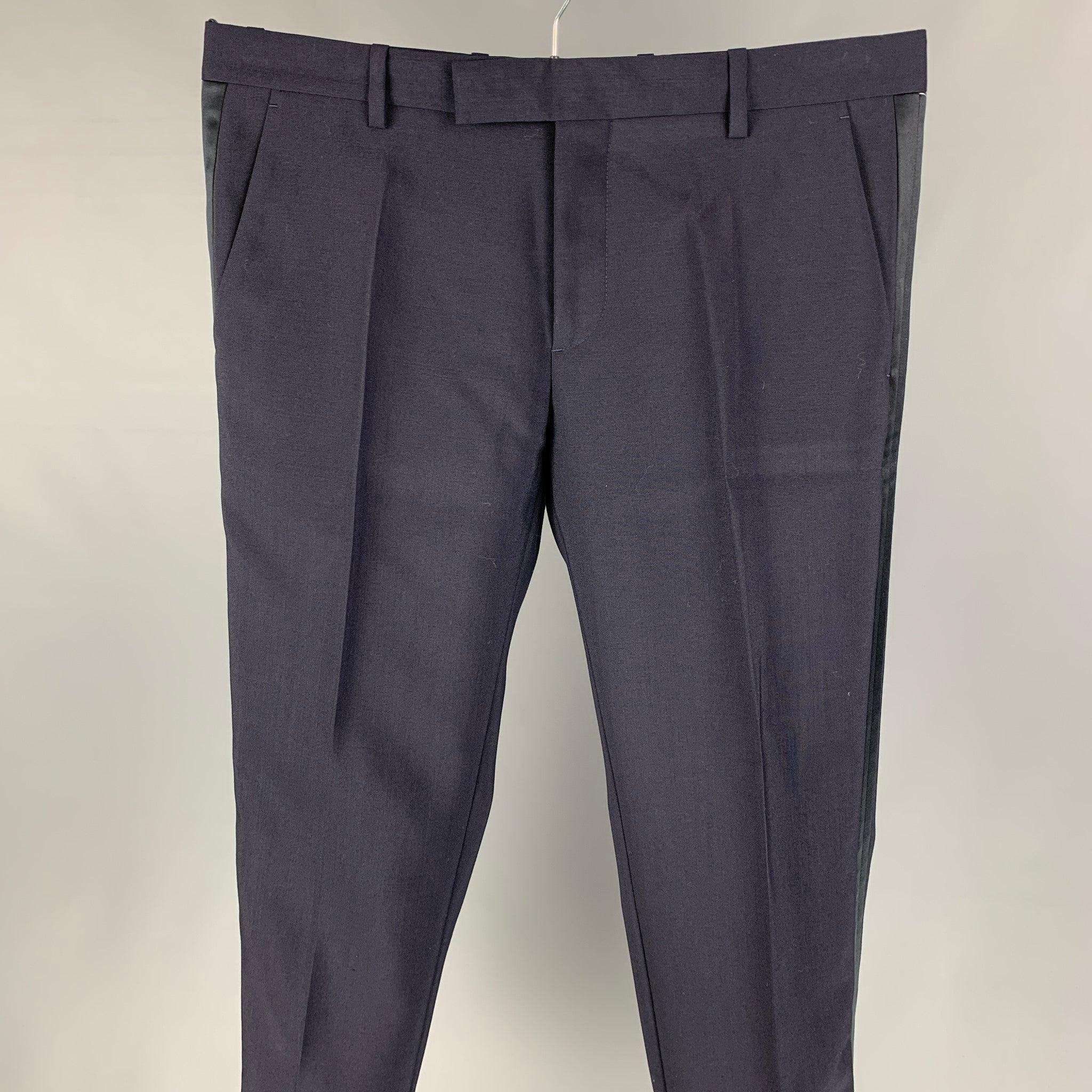 VIKTOR & ROLF tuxedo dress pants comes in a navy & black mohair featuring a slim fit, front tab, and a zip ly closure. Made in Italy.
Excellent
Pre-Owned Condition. 

Marked:   50 

Measurements: 
  Waist: 34 inches  Rise: 9.5 inches  Inseam: 33