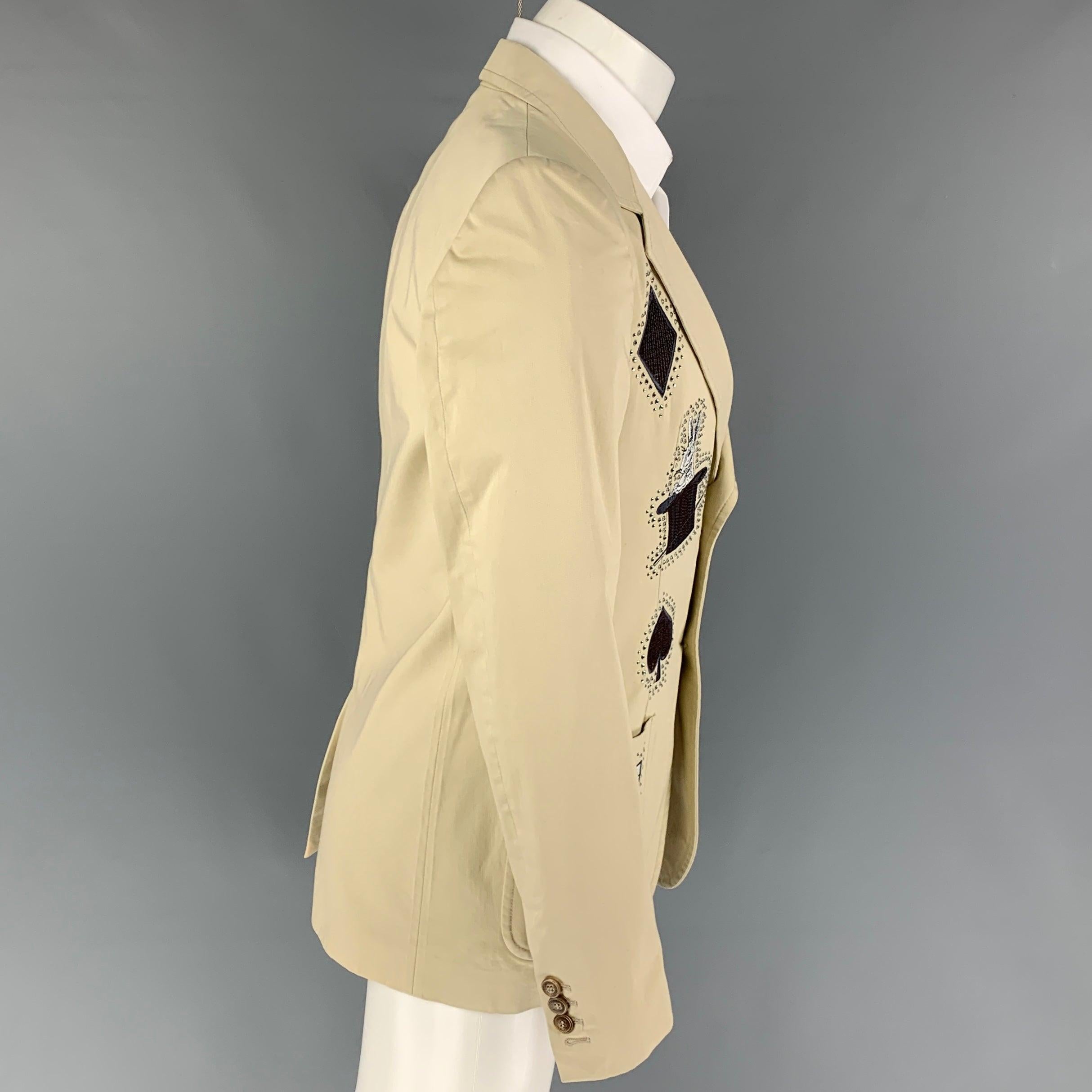 VIKTOR & ROLF sport coat comes in a beige cotton with a full liner featuring a notch lapel, embroidered designs, rhinestone details, patch pockets, single back vent, and a double button closure. Made in Italy.
New With Tags.
 

Marked:   46
