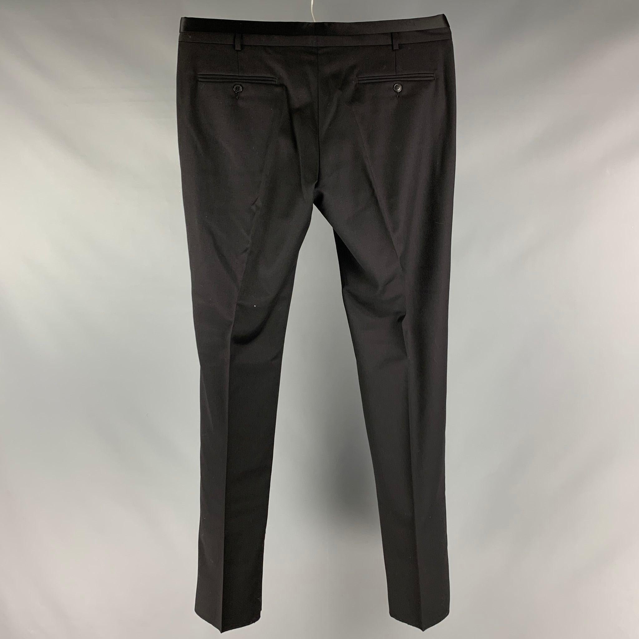 VIKTOR & ROLF dress pants comes in a black wool woven material featuring a
 tuxedo style, front tab, and a zip fly closure. Made in Italy.New with Tags. 

Marked:  54 

Measurements: 
 Waist: 38 inches Rise: 8 inches Inseam: 38 inches 

 
 

