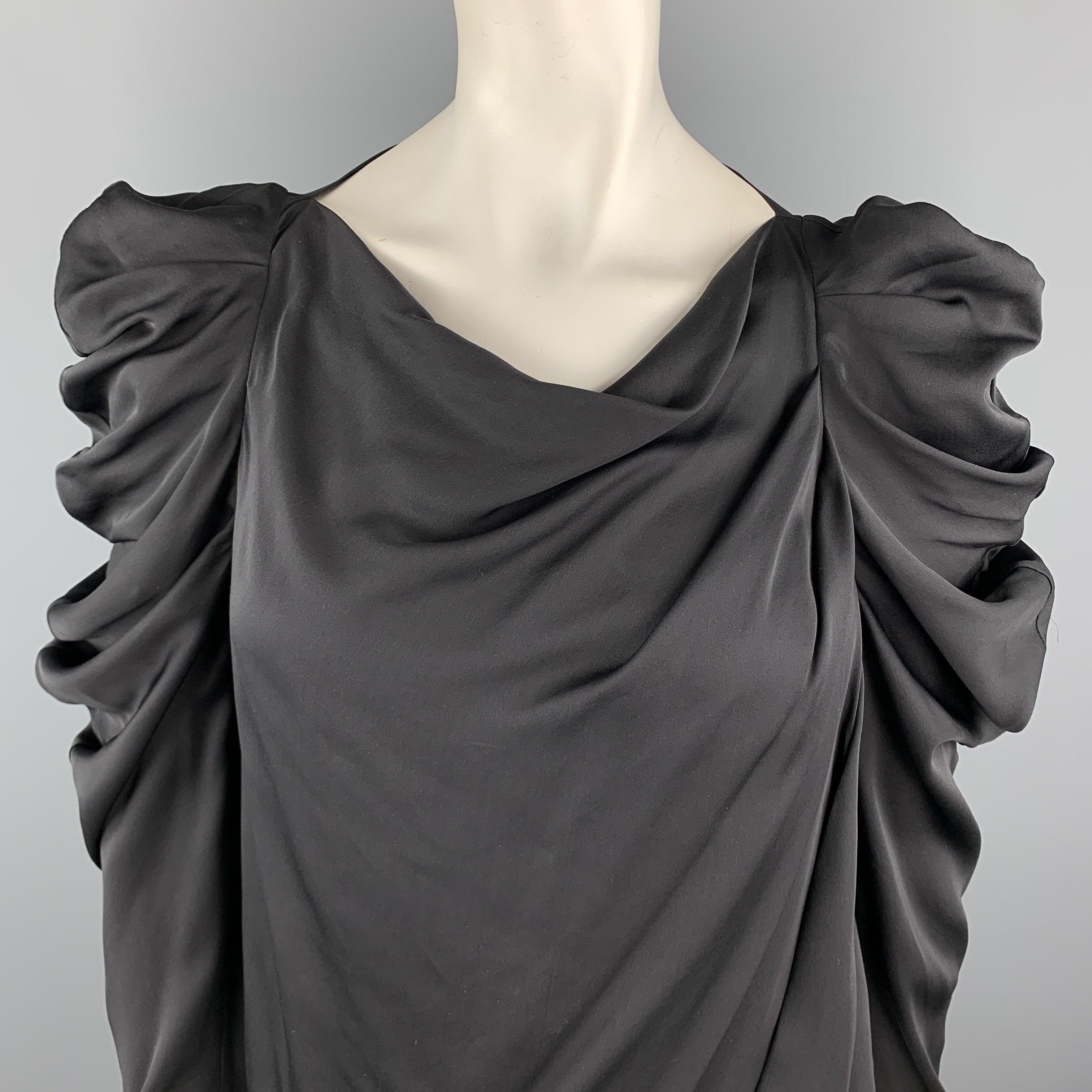 VIKTOR & ROLF blouse comes in black silk with a draped body and ruffled shoulder sleeves. Made in Italy.Excellent
Pre-Owned Condition. 

Marked:   IT 40 

Measurements: 
 
Shoulder: 11 inches Bust:
387 inches Sleeve:
27 inches Length: 22 inches 
  
