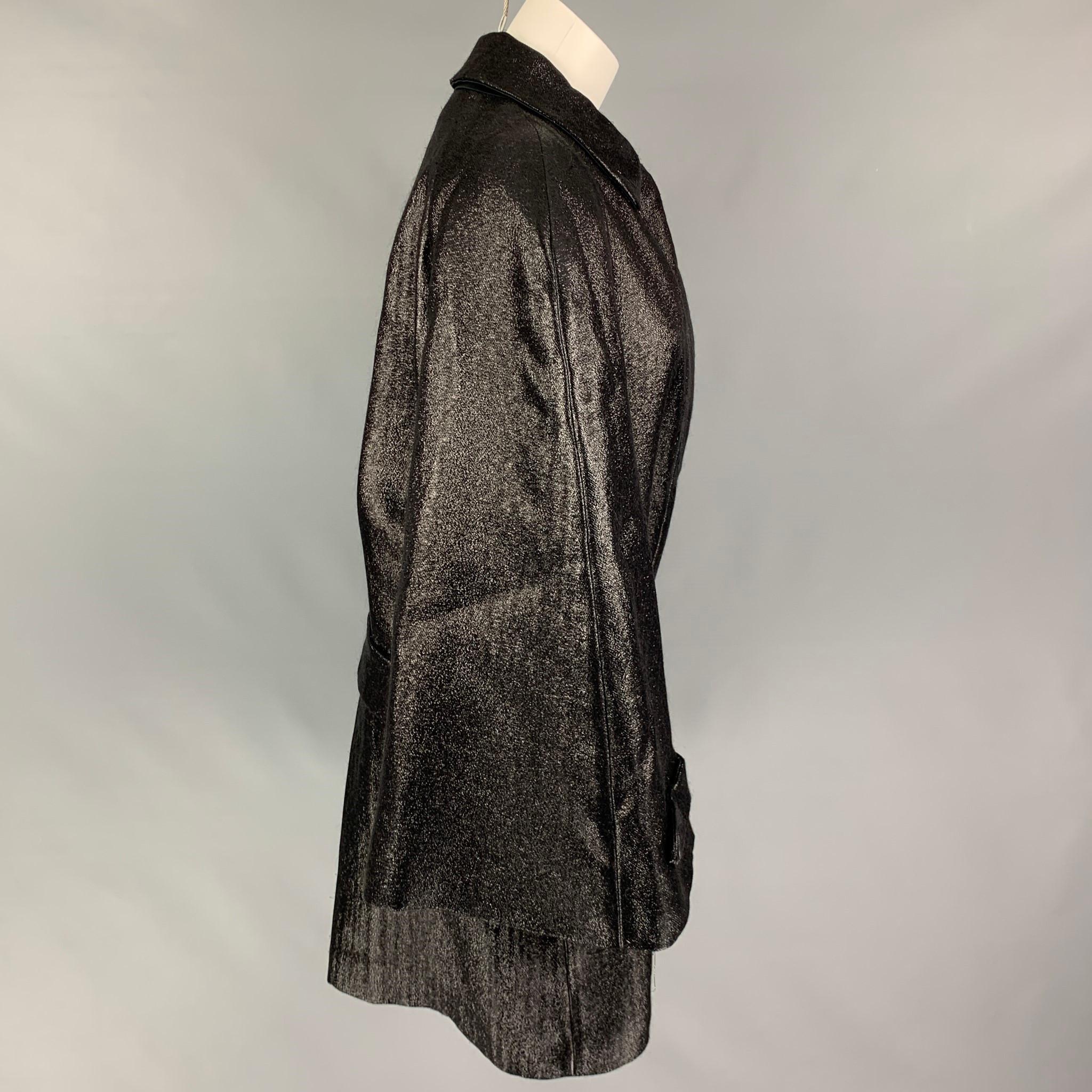 VIKTOR & ROLF coat comes in a black metallic mohair blend featuring a oversized fit, belted, slit pockets, spread collar, wide sleeves, and a hidden placket closure. Made in Italy. 

Very Good Pre-Owned Condition.
Marked: