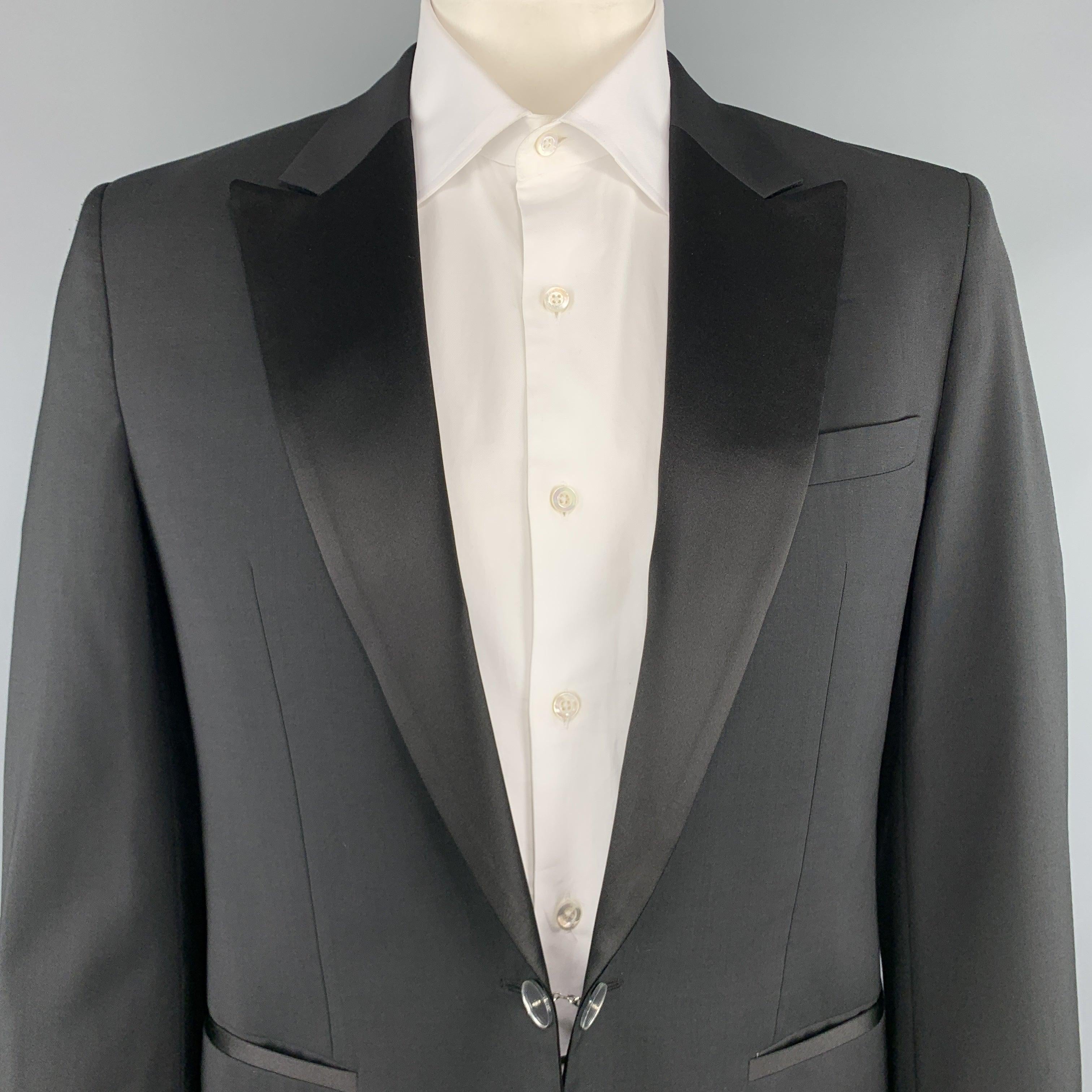 VIKTOR & ROLF single breasted tuxedo sport coat comes in black wool with a satin peak lapel and mirrored single button tab front and functional button cuff sleeves. Very minor wear on buttons. Made in Italy.
Excellent Pre-Owned Condition. 

Marked: 