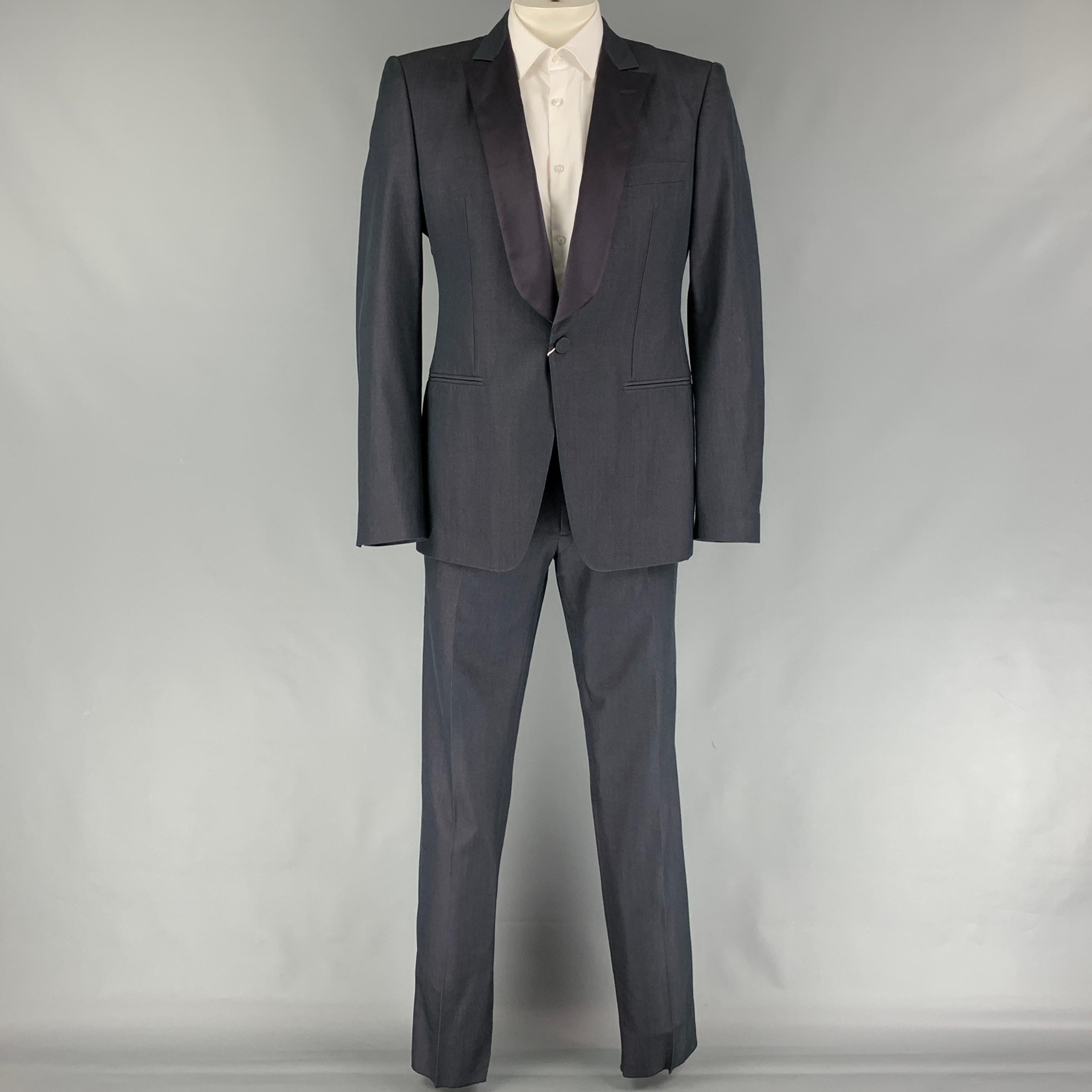 VIKTOR & ROLF tuxedo suit comes in a charcoal silk / wool and includes a single breasted, single button sport coat with notch lapel and matching flat front trousers. Made in Italy.

Very Good Pre-Owned Condition.
Marked: