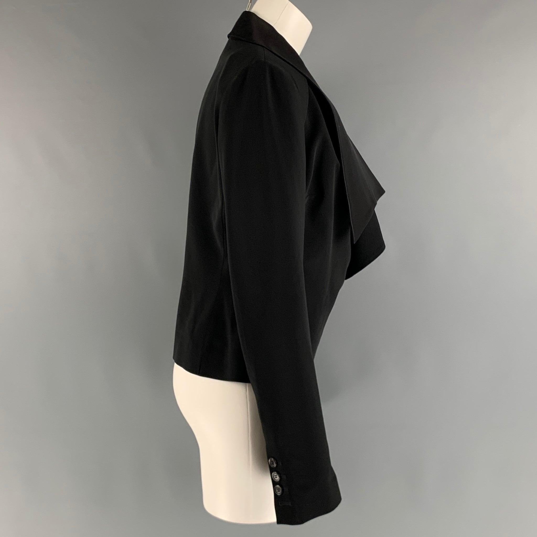VIKTOR & ROLF tuxedo jacket comes in a black polyester and spandex woven material featuring a long asymmetrical collar, and a double breasted style. Made in Italy.Excellent Pre-Owned Condition. 

Marked:   44 

Measurements: 
 
Shoulder: 16 inches