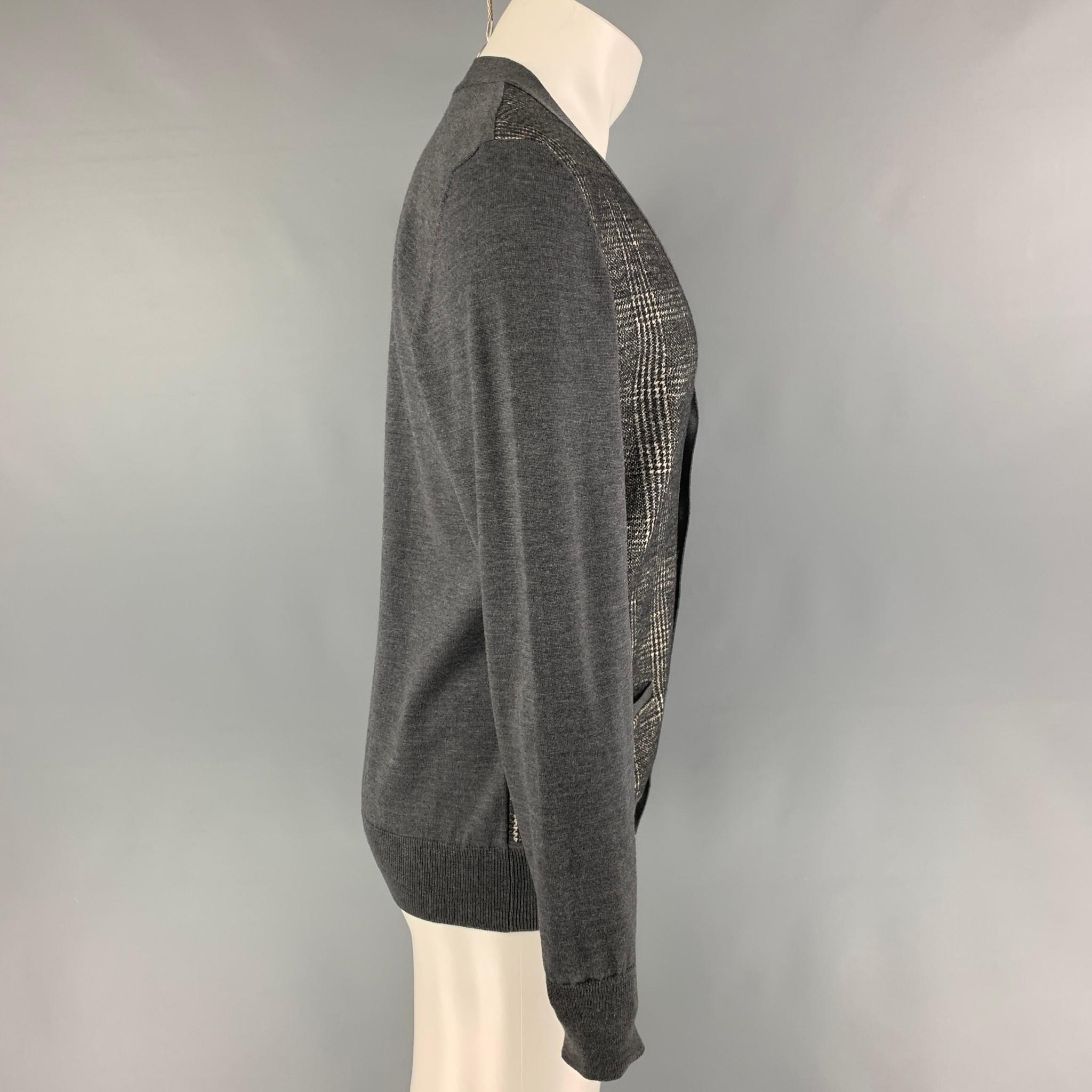 VIKTOR & ROLF cardigan comes in a grey & cream mixed print wool featuring front pockets and a buttoned closure. Made in Italy. 

Very Good Pre-Owned Condition.
Marked: M

Measurements:

Shoulder: 18 in.
Chest: 41 in.
Sleeve: 27 in.
Length: 27 in. 