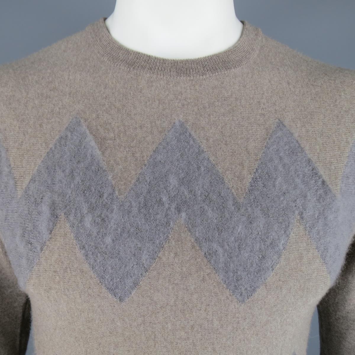 VIKTOR & ROLF Sweater consists of wool/mohair material in a taupe color tone. Designed in a crew-neck collar, zig-zag front pattern with mohair detail in grey and brown. Made in Italy. Excellent Pre-Owned Condition Marked Size: