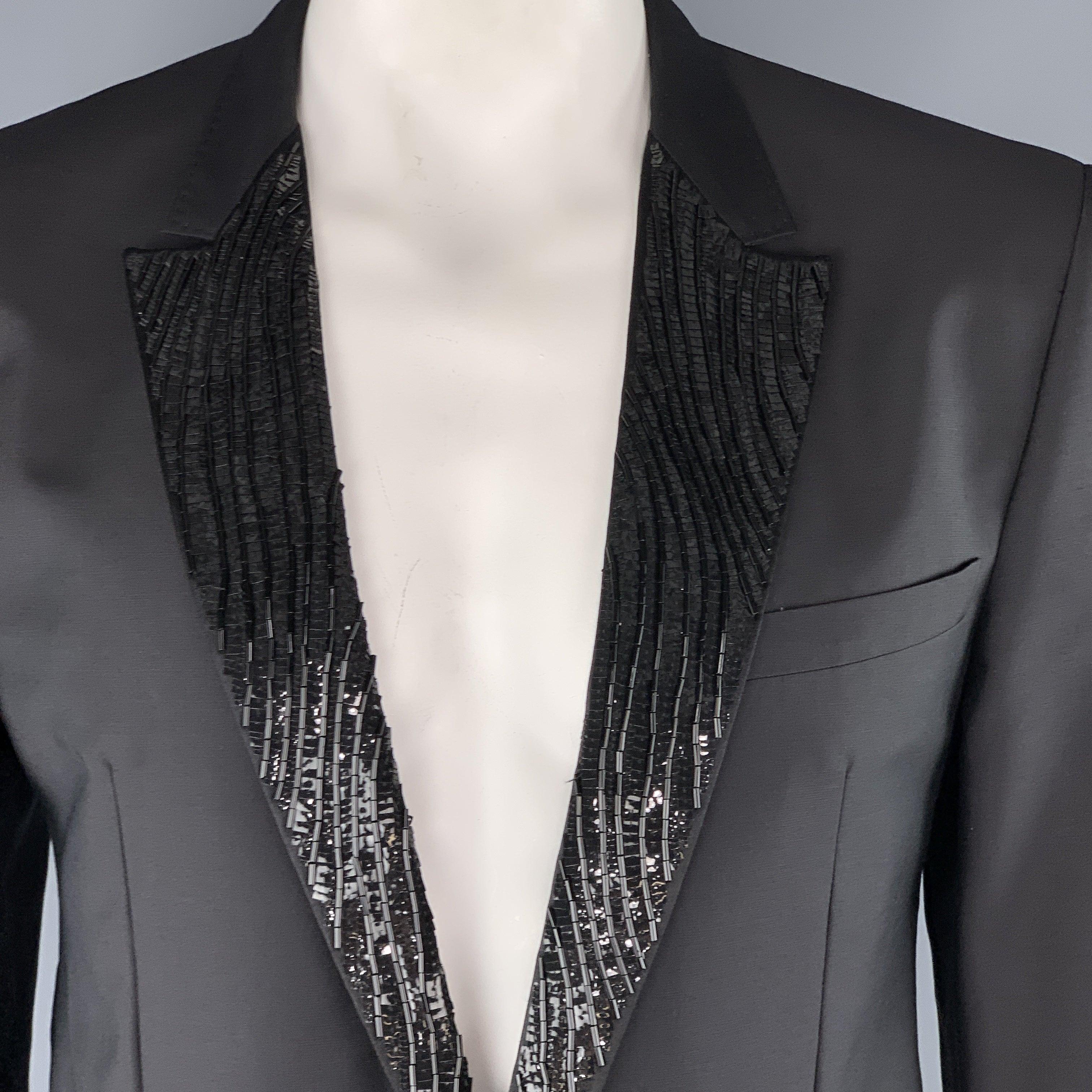 VIKTOR & ROLF
tuxedo sport coat comes in black mohair blend fabric with a sequin beaded peak lapel, single breasted, one button front, and single vented back. Made in Italy.Excellent Pre-Owned Condition. 

Marked:   EU 56 

Measurements: 
