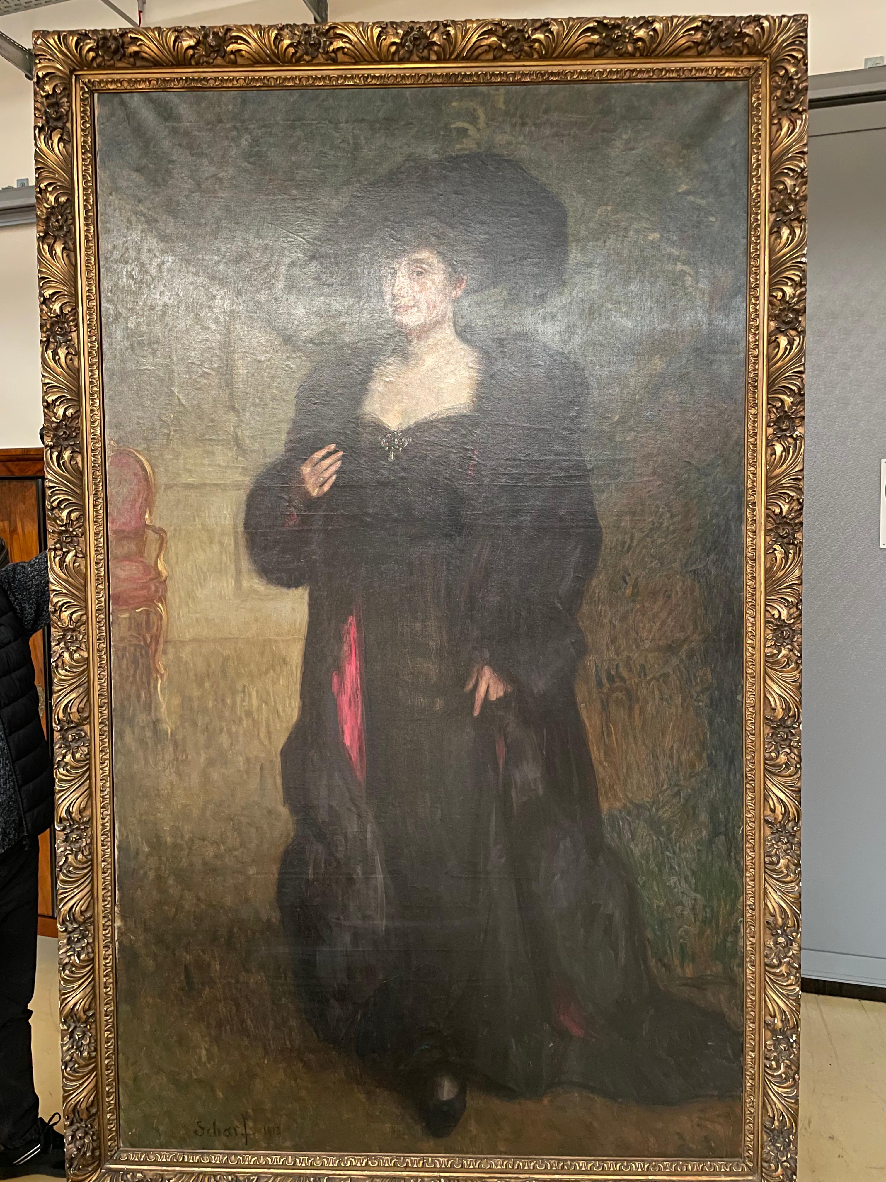 Viktor Scharf (1872–1943)
Oil on Canvas
Flat: 225 × 133 cm
Framed: 245 × 155 cm
This elegant and atmospheric portrait, painted by Viktor Scharf (1872–1943), is a striking example of early 20th-century portraiture, capturing the refined aesthetics of