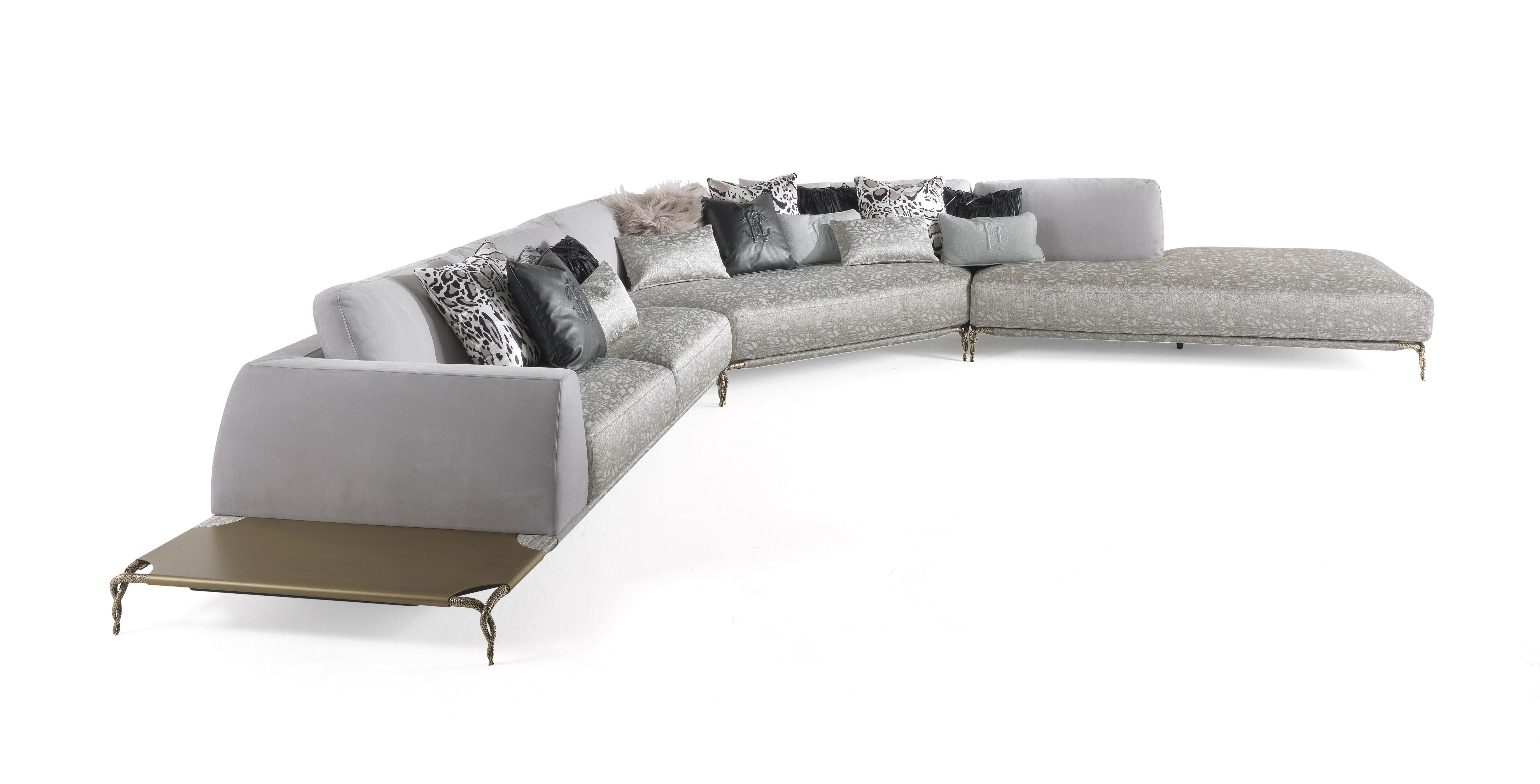 Collection of sofas and modular sofas with a structure in metal and multilayer wood. Filling in feathers and foam. Upholstery in fabric or leather from the collection. Feet available in cast brass coated gold finishing. Shelves in metal brushed