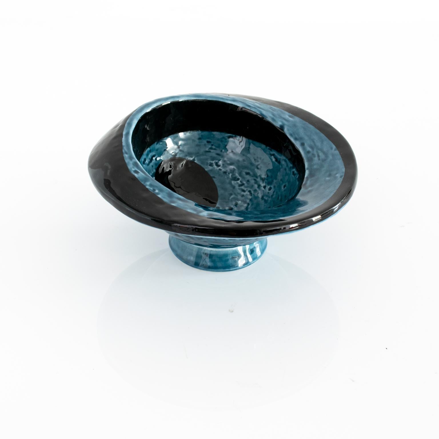 Danish artist and ceramicist Vilhelm Bjerke Petersen small blue and black glazed surrealist bowl for Rorstrand, circa 1960s. 

Measures: Diameter 6.5