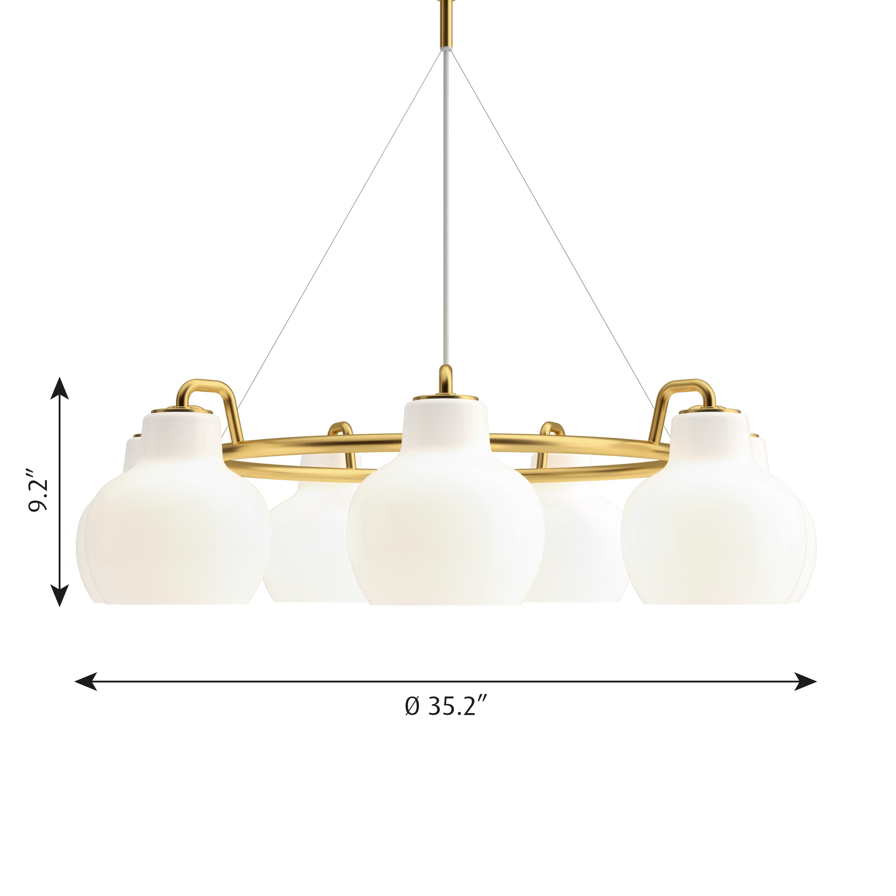 Vilhelm Lauritzen 7- shade brass & glass ring chandelier for Louis Poulsen. Executed in seven hand blown glossy white opal glass and untreated polished brass tube and ceiling canopy. The chandelier emits light directed primarily downwards. The opal