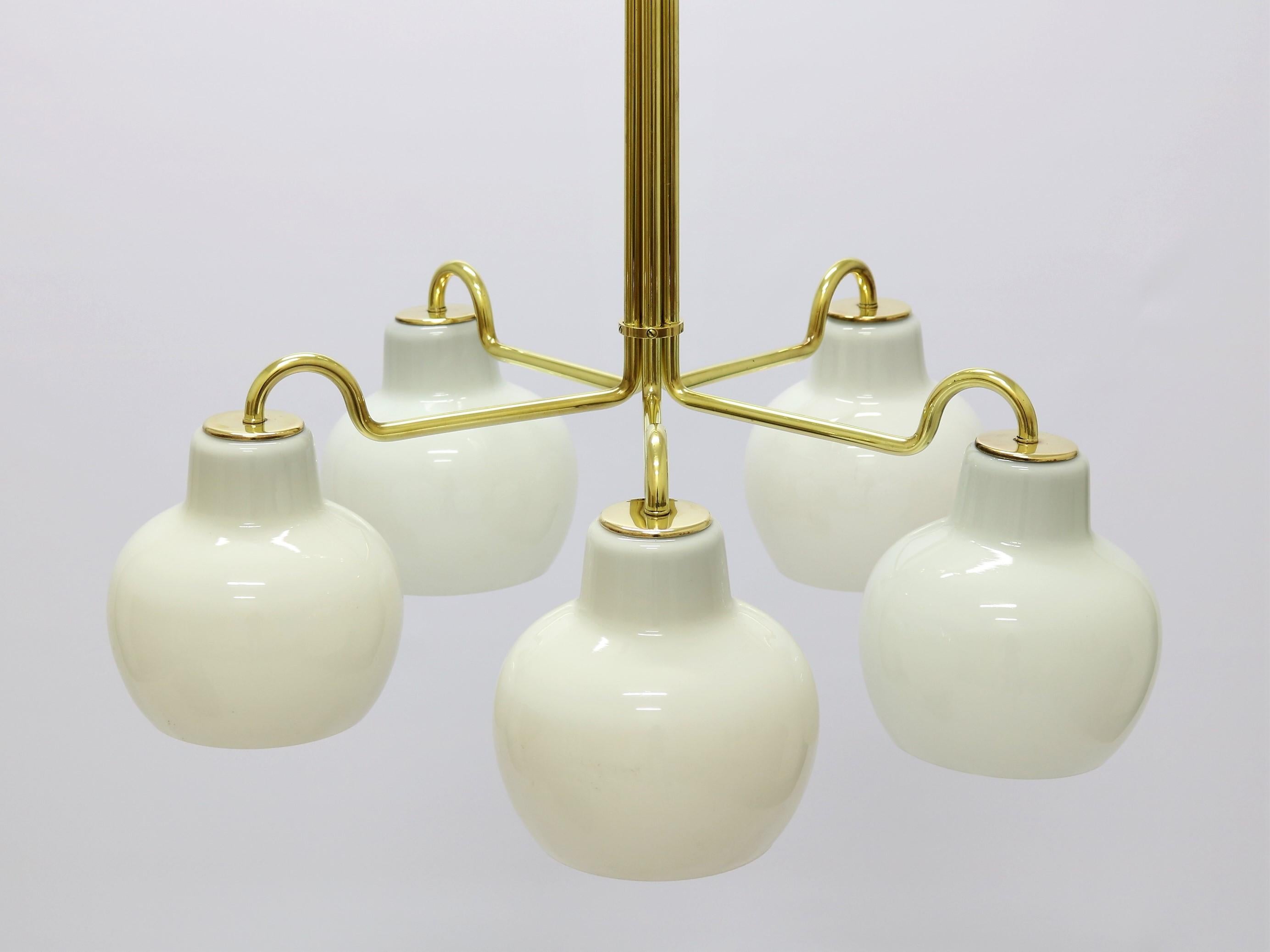 Rare Chandelier with 5 shades designed by Danish designer Vilhelm Lauritzen. Produced by Louis Poulsen, Denmark in the 1950s. Brass and shades of Opal glass.