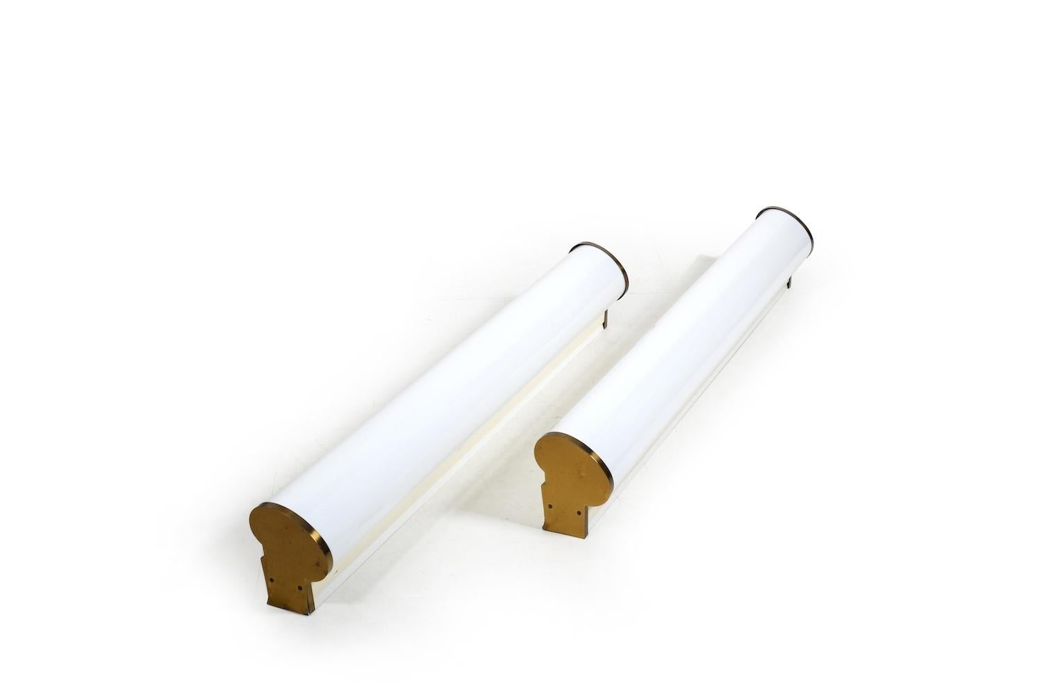 Pair of wall / ceiling lamp by Vilh. Lauritzen for Louis Poulsen Denmark, 1953. Model „Rådhusarmatur“. Opaline acrylic glass and brass ends. According to the previous owner, these lamps were made with smooth, non-ribbed plastic lamp glasses by Louis