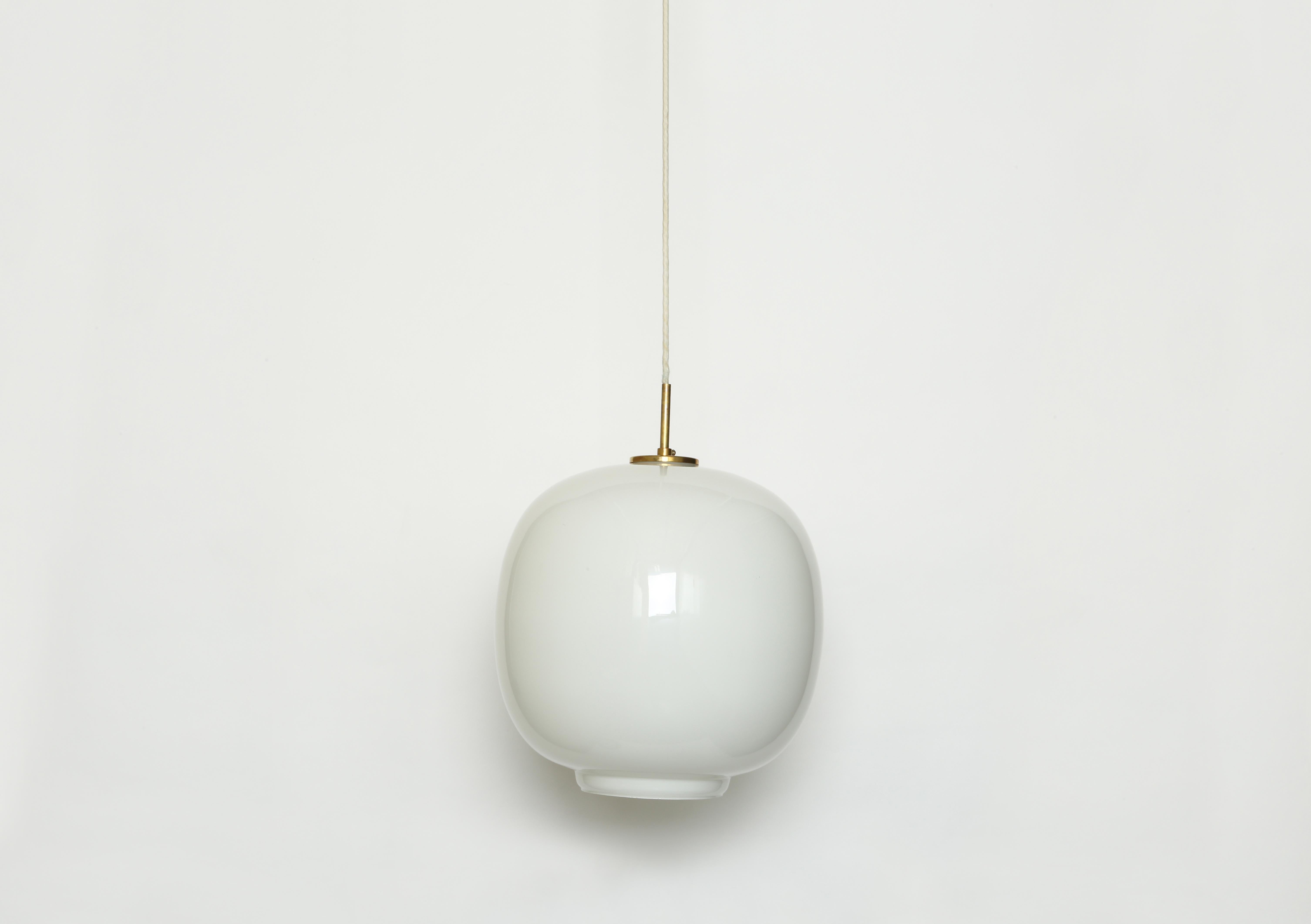 Vilhelm Lauritzen for Louis Poulsen pair of ceiling pendants.
Designed by Danish architect Vilhelm Lauritzen for the broadcasting House in Copenhagen, Radiohouse.
Made by Louis Poulsen.
Handblown glass, brass mounts with beautiful