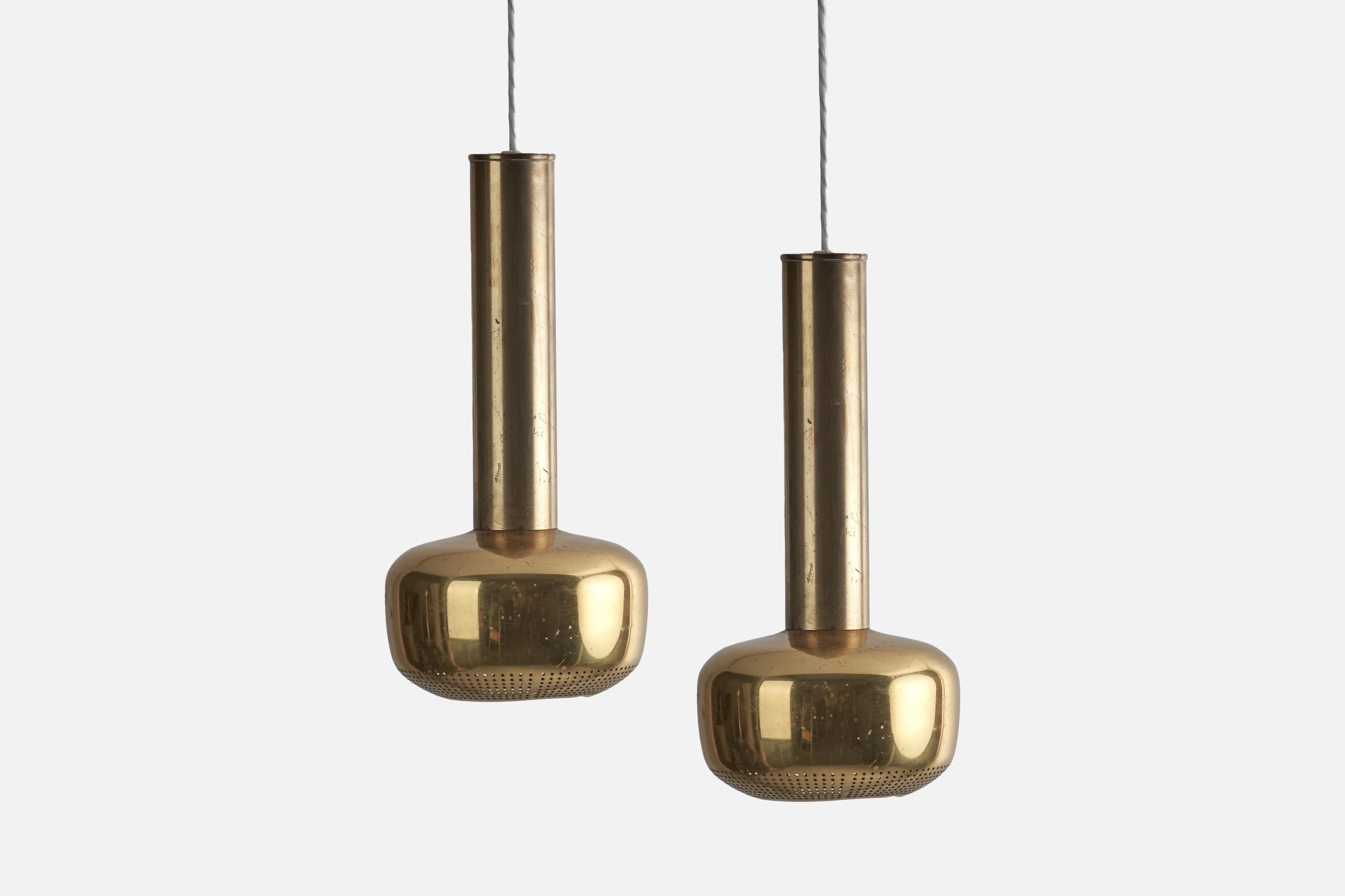 A set of 3 brass pendants designed by Vilhelm Lauritzen and produced by Louis Poulsen, Denmark, c. 1950s.

Pendants sold without canopy.

Sockets take standard E-26 medium base bulbs.

There is no maximum wattage stated on the fixtures.