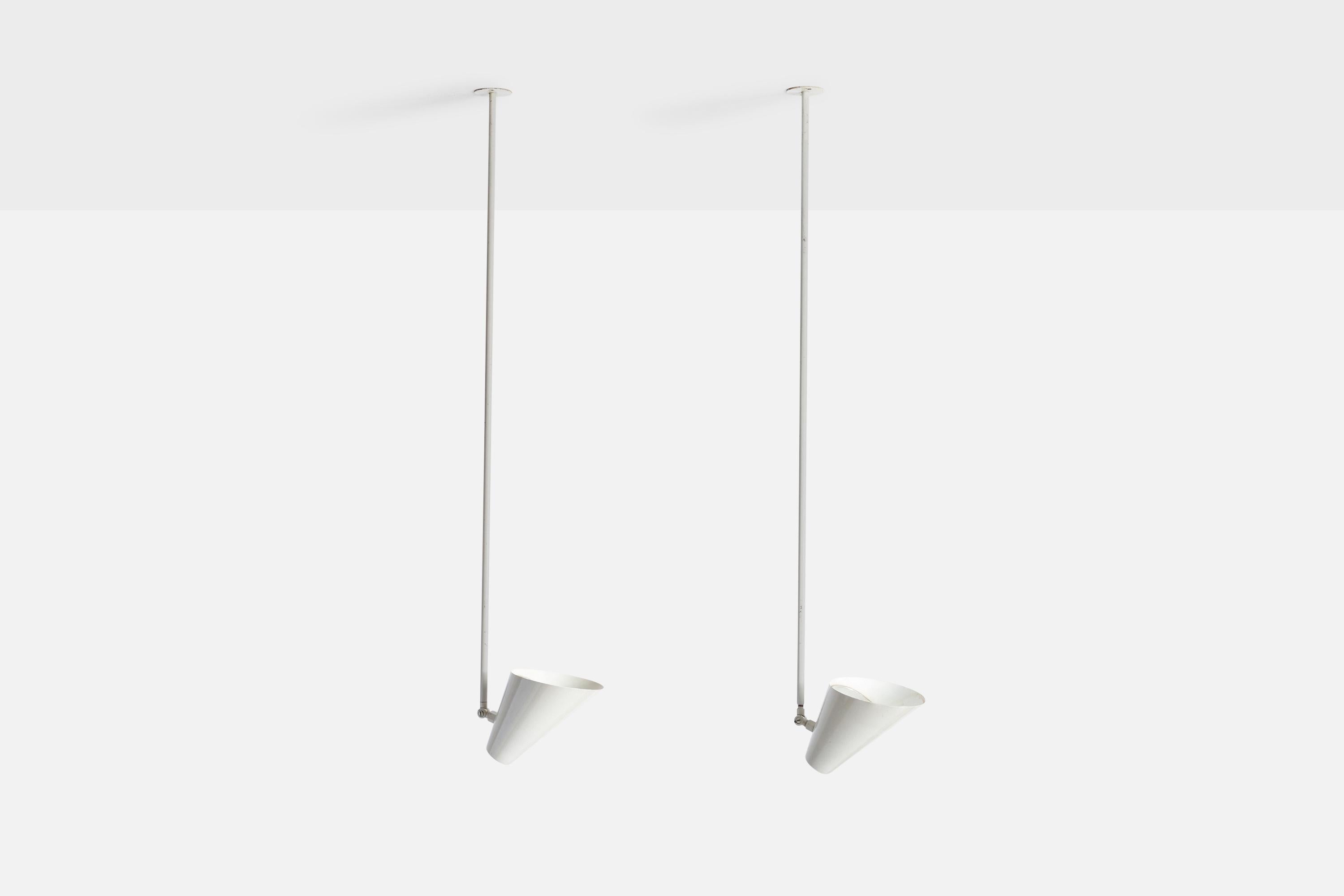 A pair of white lacquered metal pendant lights designed by Vilhelm Lauritzen and produced by Louis Poulsen, Denmark, c. 1950s.

Dimensions of canopy (inches): N/A
Socket takes standard E-26 bulbs. 2 sockets.There is no maximum wattage stated on the