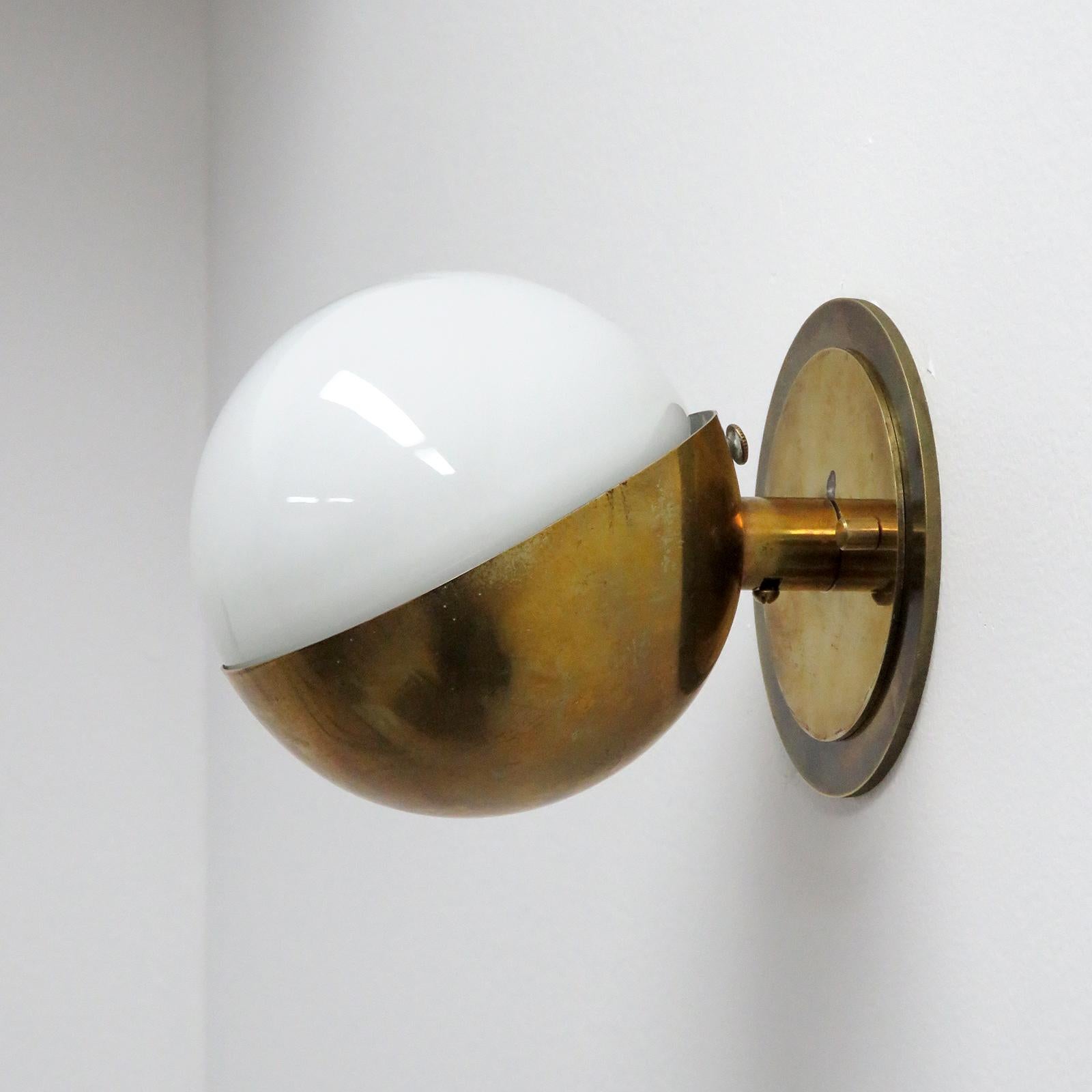 Remarkable small 'Radiohuset' wall light, by Vilhelm Lauritzen for Louis Poulsen, in patinaed brass and opaline glass designed in 1931 for the Broadcasting House in Copenhagen.
 