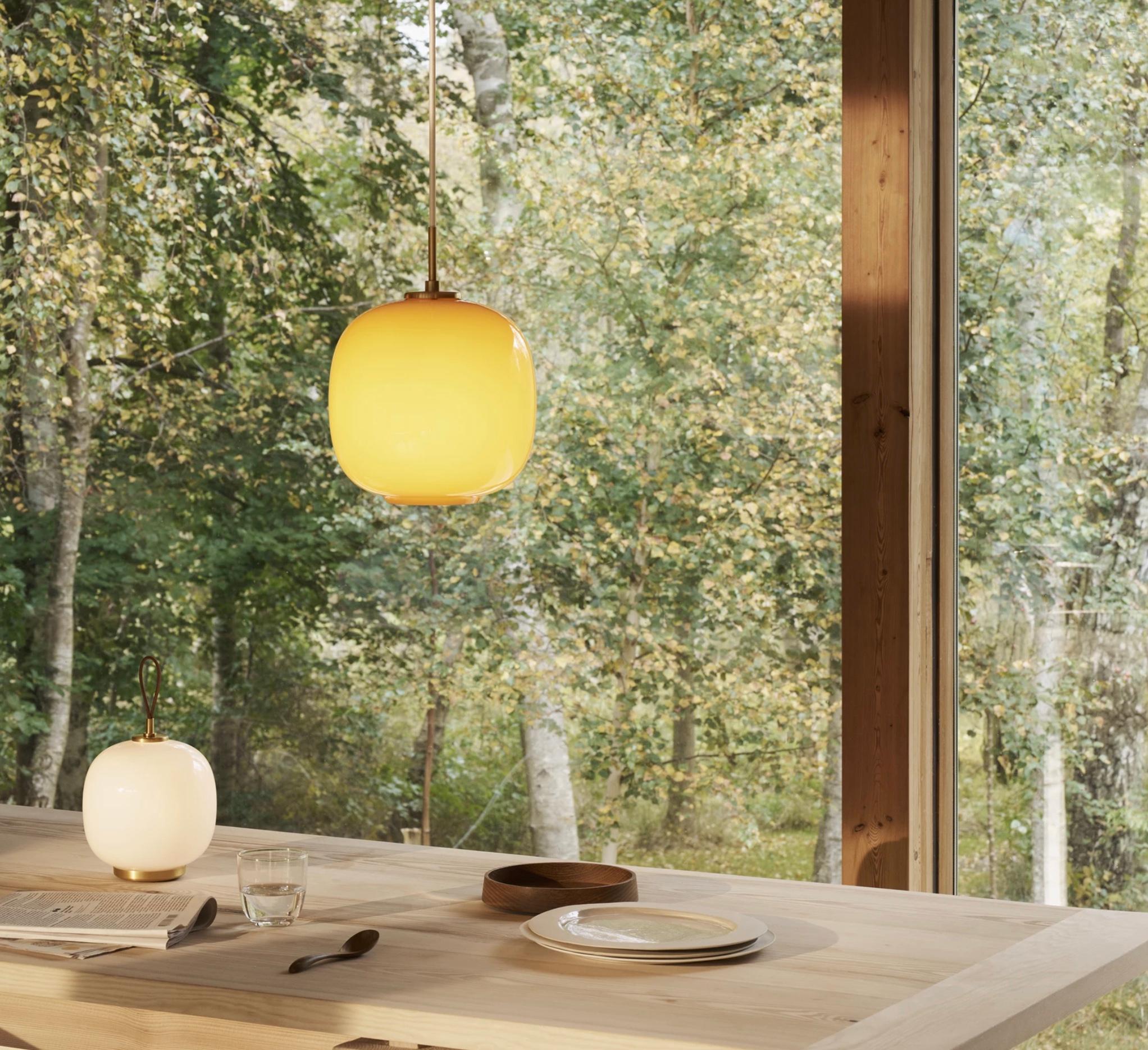 Vilhelm Lauritzen VL 45 'Radiohus' Pendant Ø250 in Brass and Pale Yellow Glass. New, current production.

The VL 45 Radiohus Pendant was originally designed by Danish architect Vilhelm Lauritzen for his gesamtkunstwerk at the Danish Broadcasting