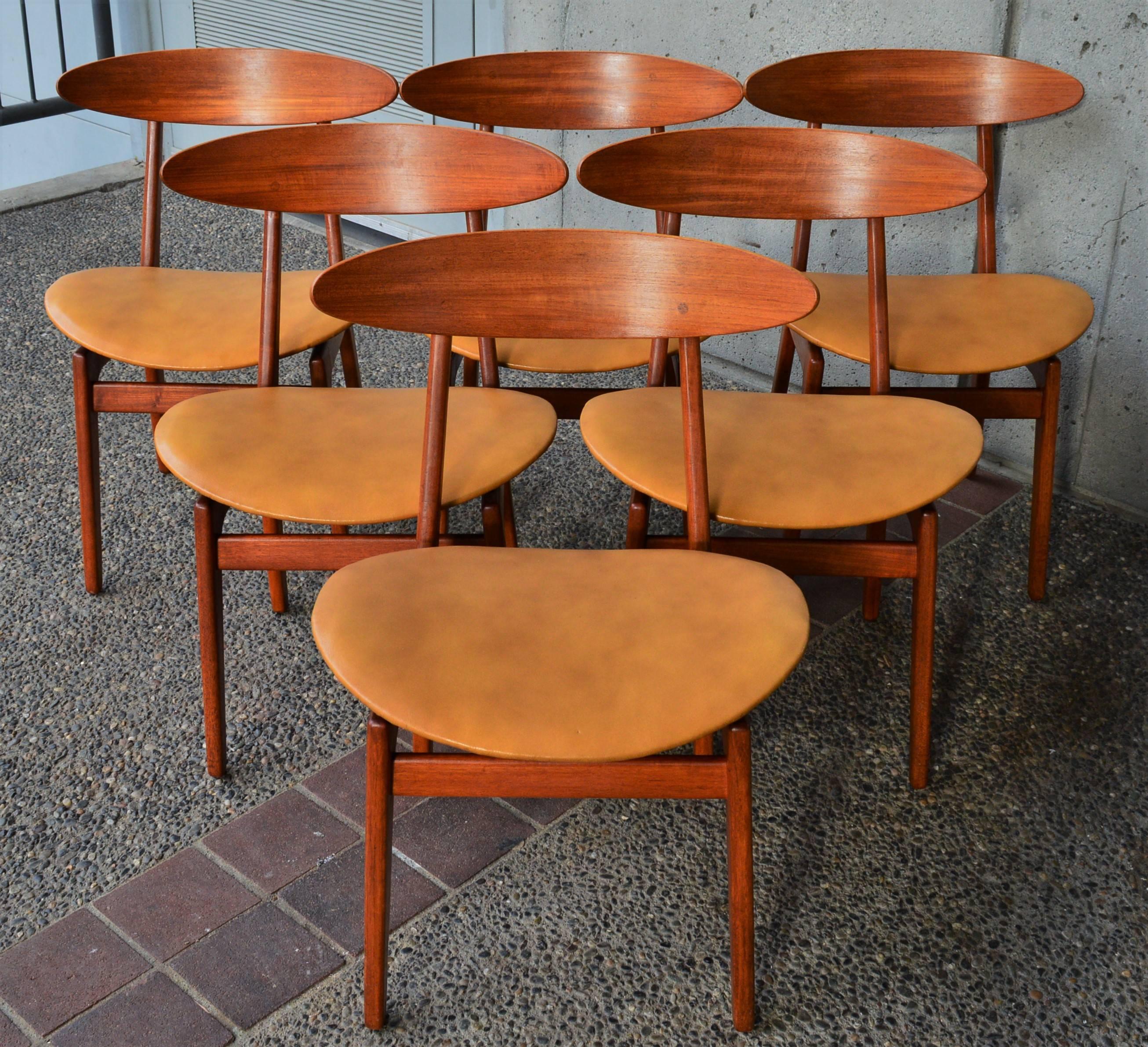 This incredible set of six rare chairs were designed by Vilhelm (some say Wilhelm) Wohlert in the 1950s and feature a beautifully curved narrow bentply ovoid backrest, impeccable joinery for the leg braces and unique reversed pyramid seat supports