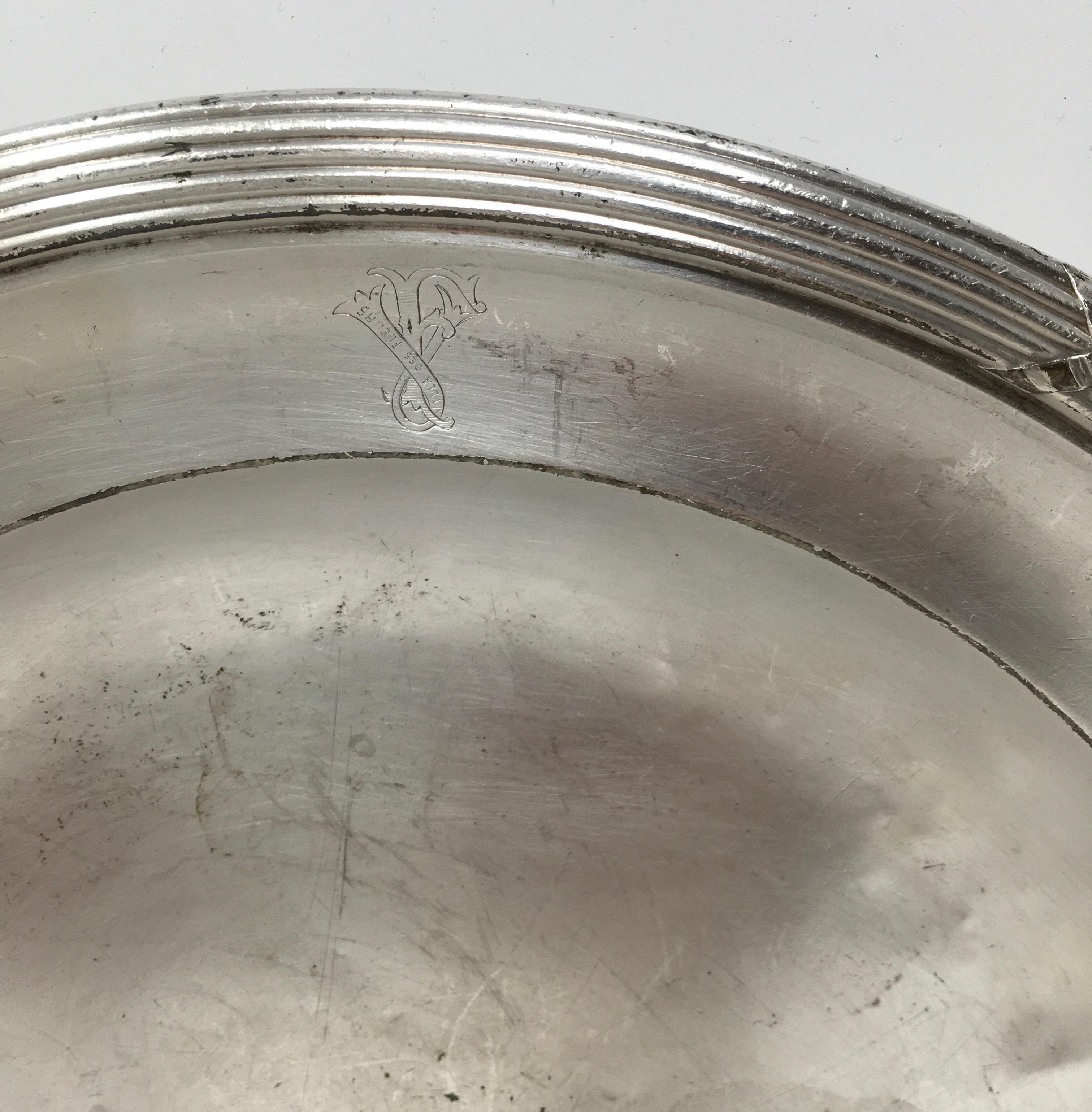Found in France, this vintage hotel silver serving platter engraved with the Villa de Fleurs logo has a great aged patina. It would be beautiful in a cabinet and a great addition to your table or buffet.
