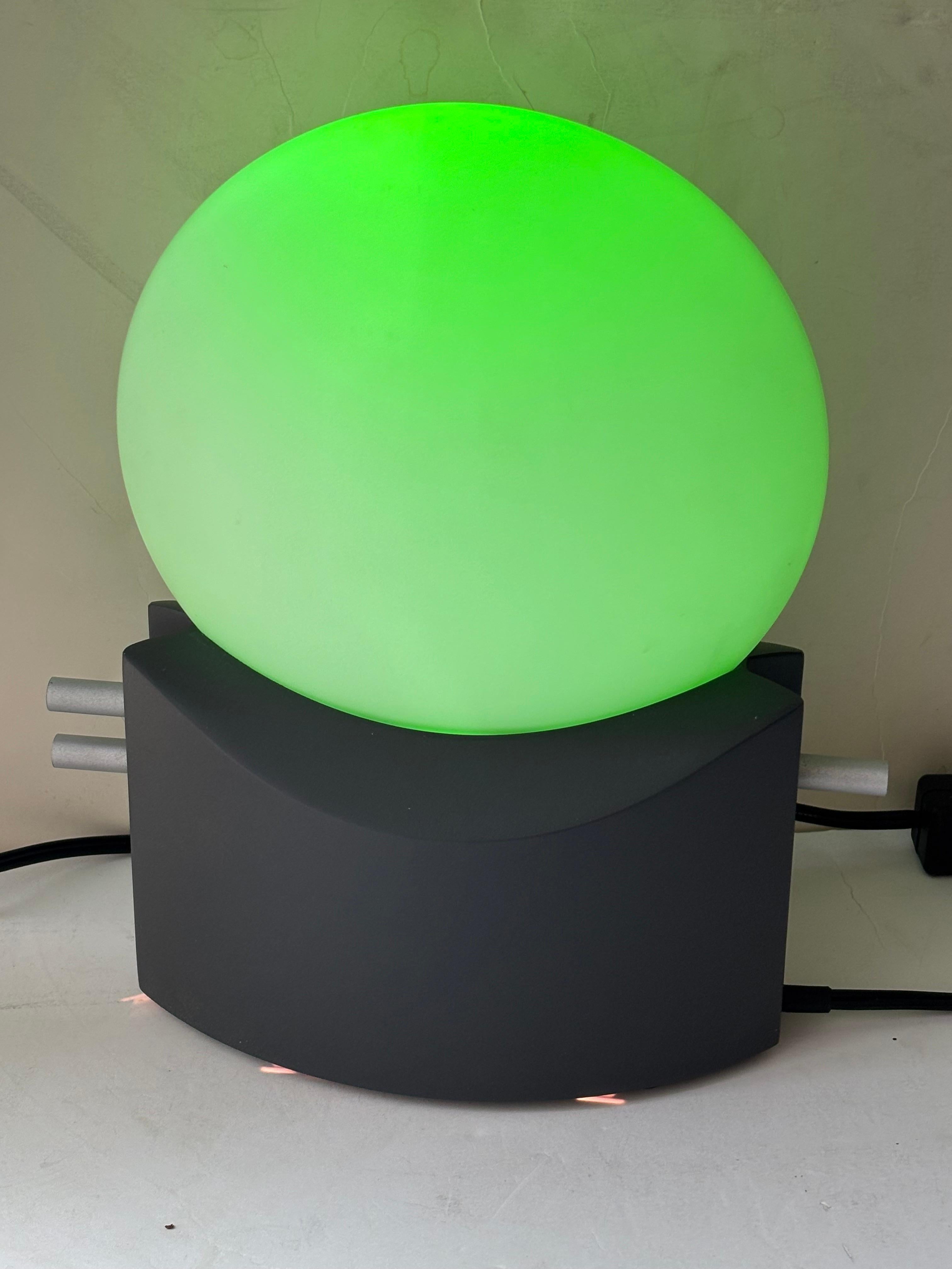 This lamp is an amazing post modern work  that shows many  colors ,tones and levels of brightness that you can achieve playing with all the nobes in both sides .Red , green, purple , lavender , yellow etc. Villa Tosca Design was  created in 1993