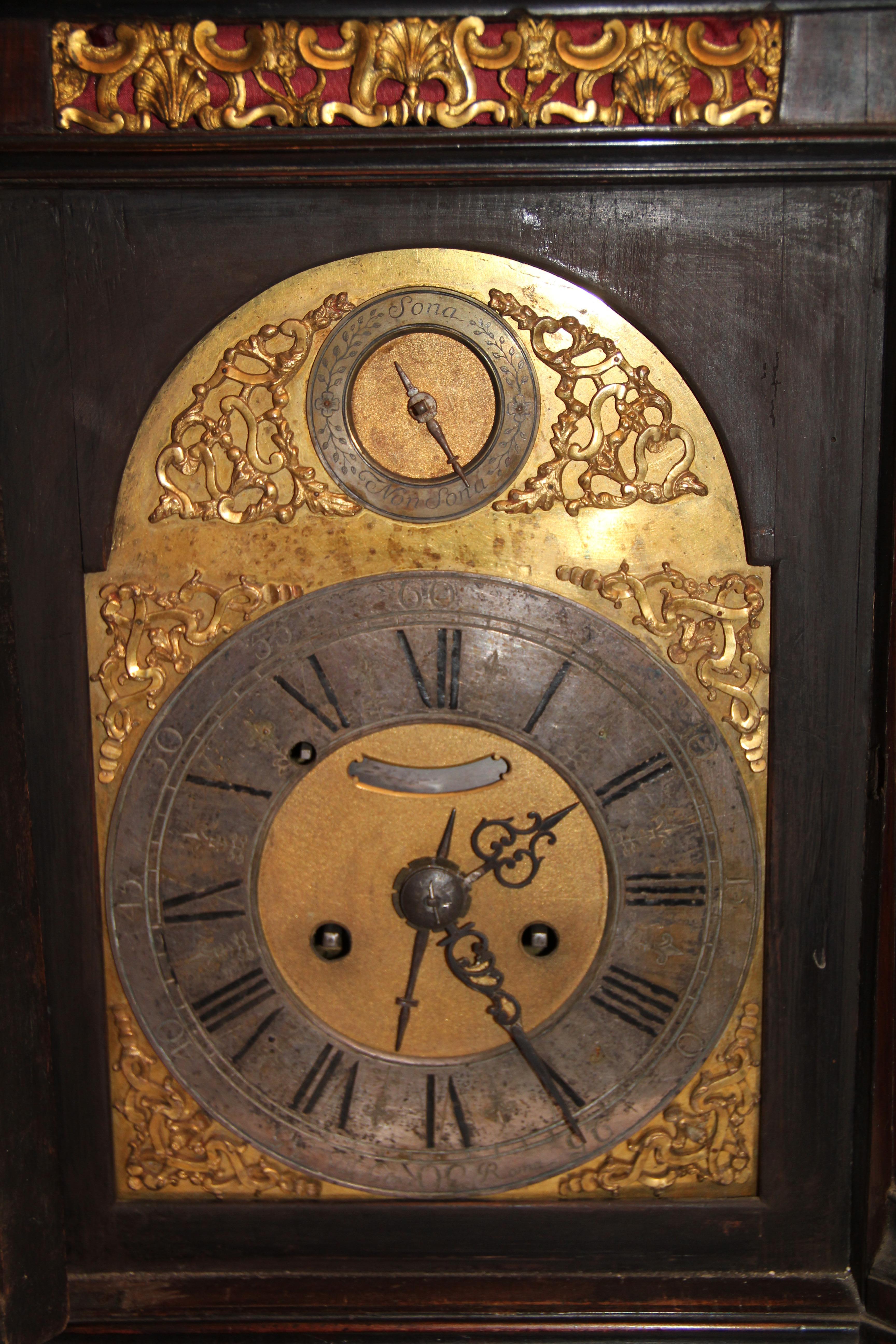A clock in rosewood veneer and ebonized wood, verge escapement, twin spring powered, dual bell, time strike and alarm, architectural bracket clock, made by “Villacroce”, (clockmaker in “Roma”), circa third quarter of the 18th century.

Case: 24