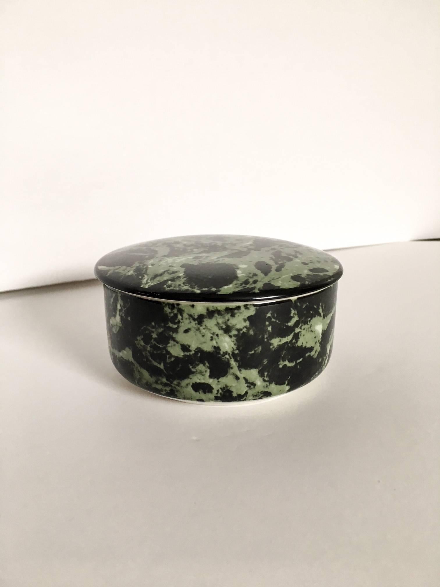 Lovely porcelain round lidded box by the renowned German ceramic house Villeroy & Boch.  Decorated in a mint green and black allover marbleized pattern. 