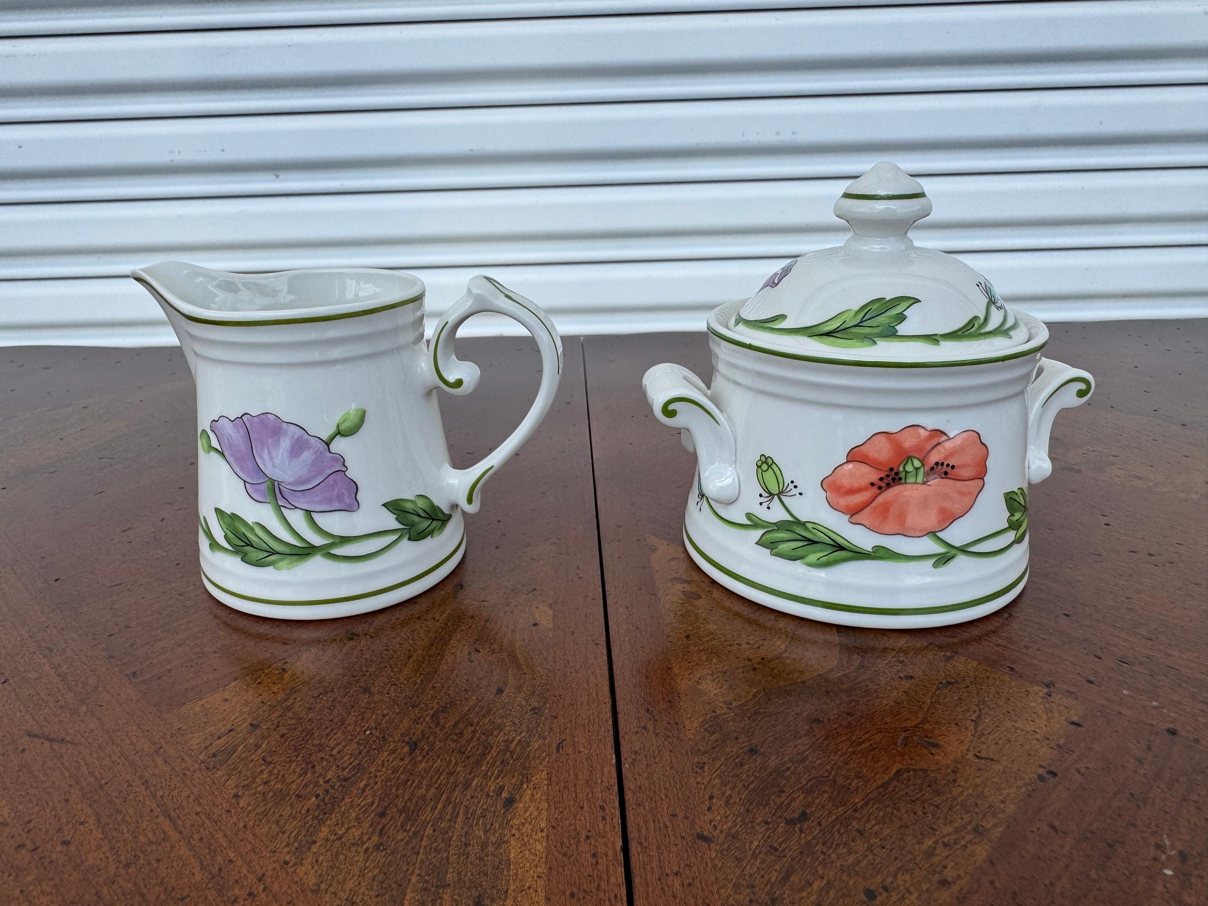 Bring timeless elegance to your dining table with this stunning Villeroy & Boch Amapola dinnerware collection. Featuring the classic Amapola poppy flower pattern, this premium porcelain set includes a floral gravy boat, covered vegetable tureen,