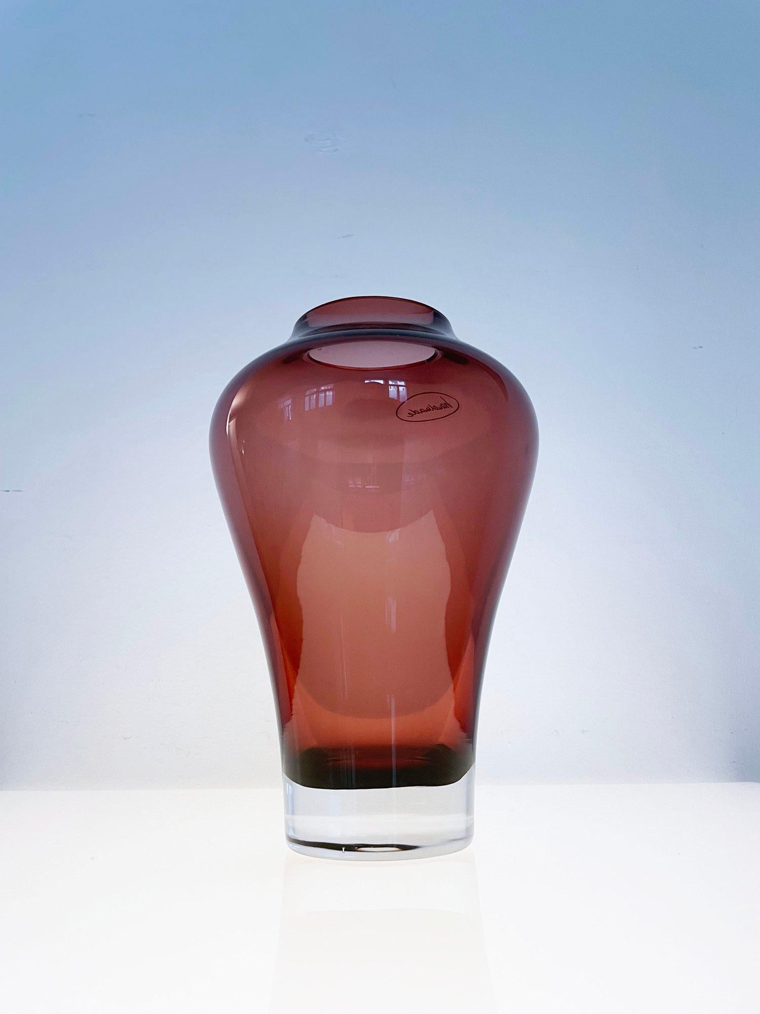 Handmade Villeroy & Boch pear shaped glass vase. Makers mark inscribed on base. Wine coloured glass with an organic form. For use as a decorative or as a functional vessel for holding flowers or other decorative elements. 