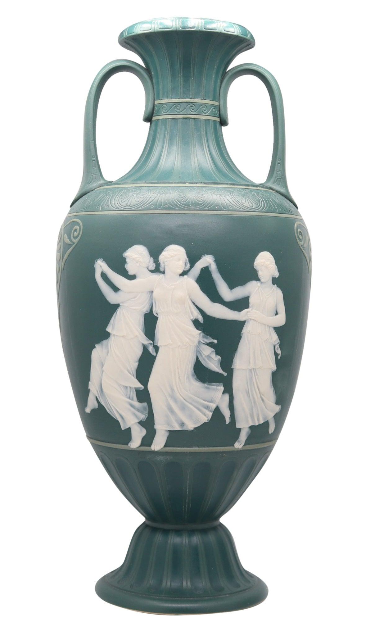 A neo classic green cameo amphora designed by Villeroy & Boch in Mettlach.

This is a very rare tall Phanolith cameo vase, created in Germany by the Villeroy & Boch Mettlach company, back in the 1890's. The massive tall vase has been crafted with